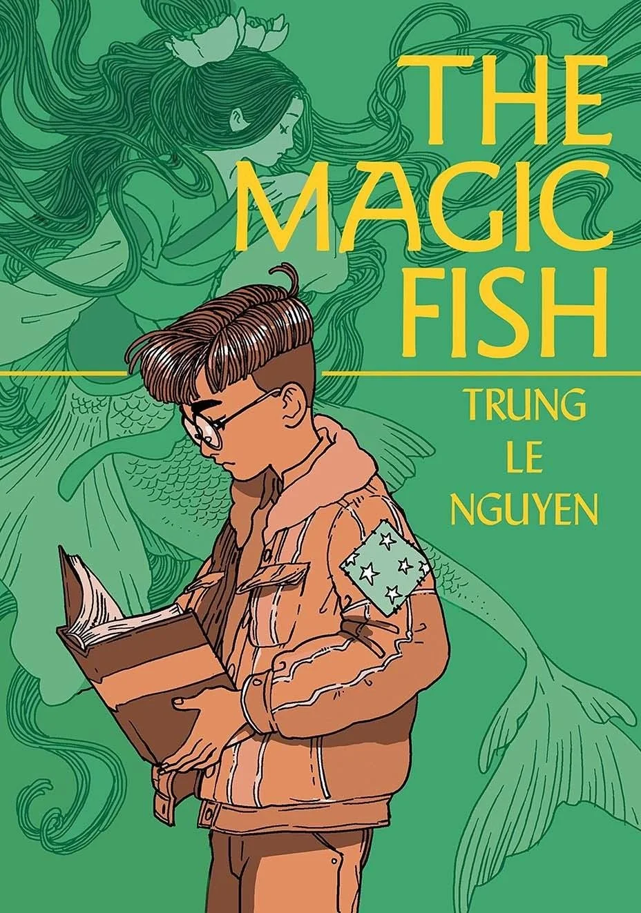 Book cover featuring a young person with glasses reading a book, with an illustrated mermaid in the background and the title 'The Magic Fish' by Trung Le Nguyen.