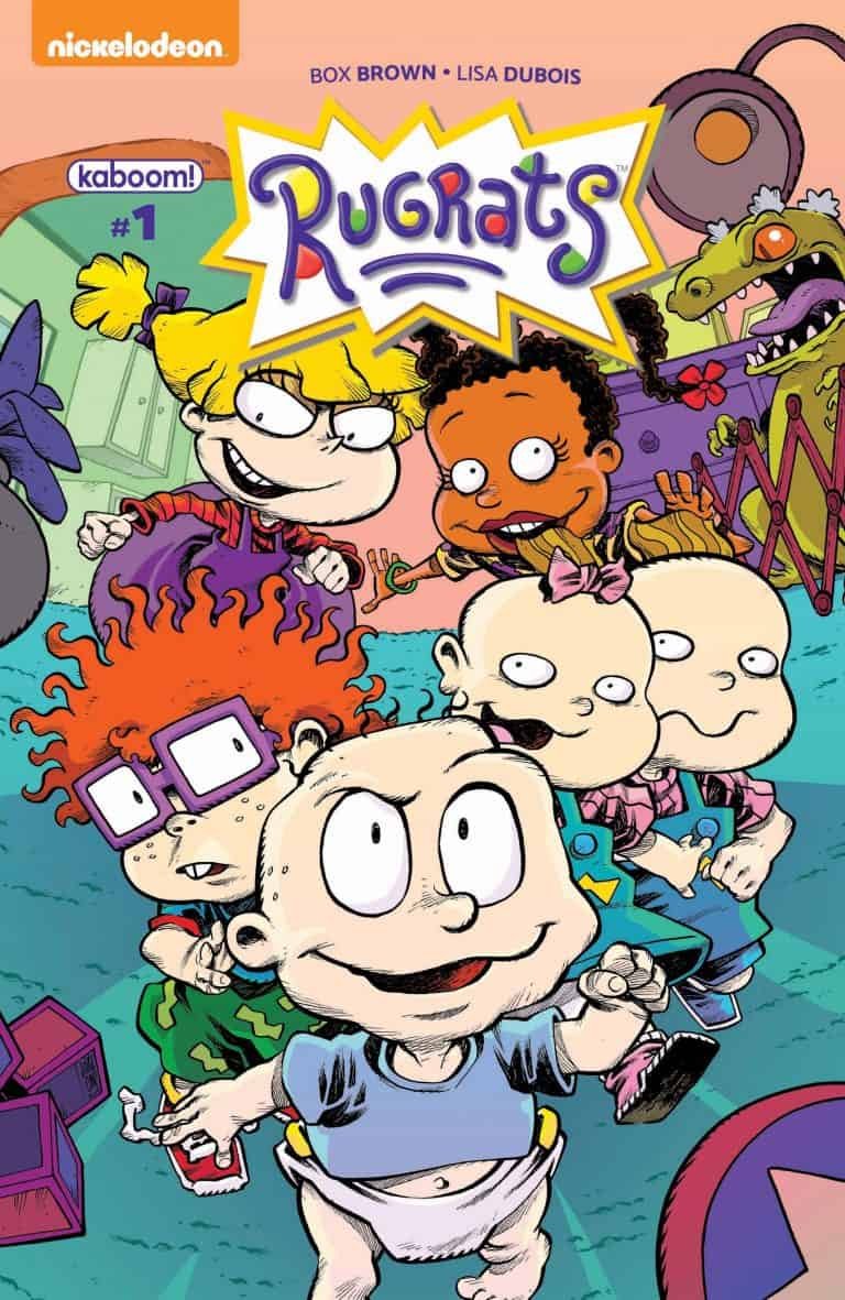 Cover of Rugrats comic book with cartoon characters including Tommy, Chuckie, Angelica, and others in colorful surroundings.