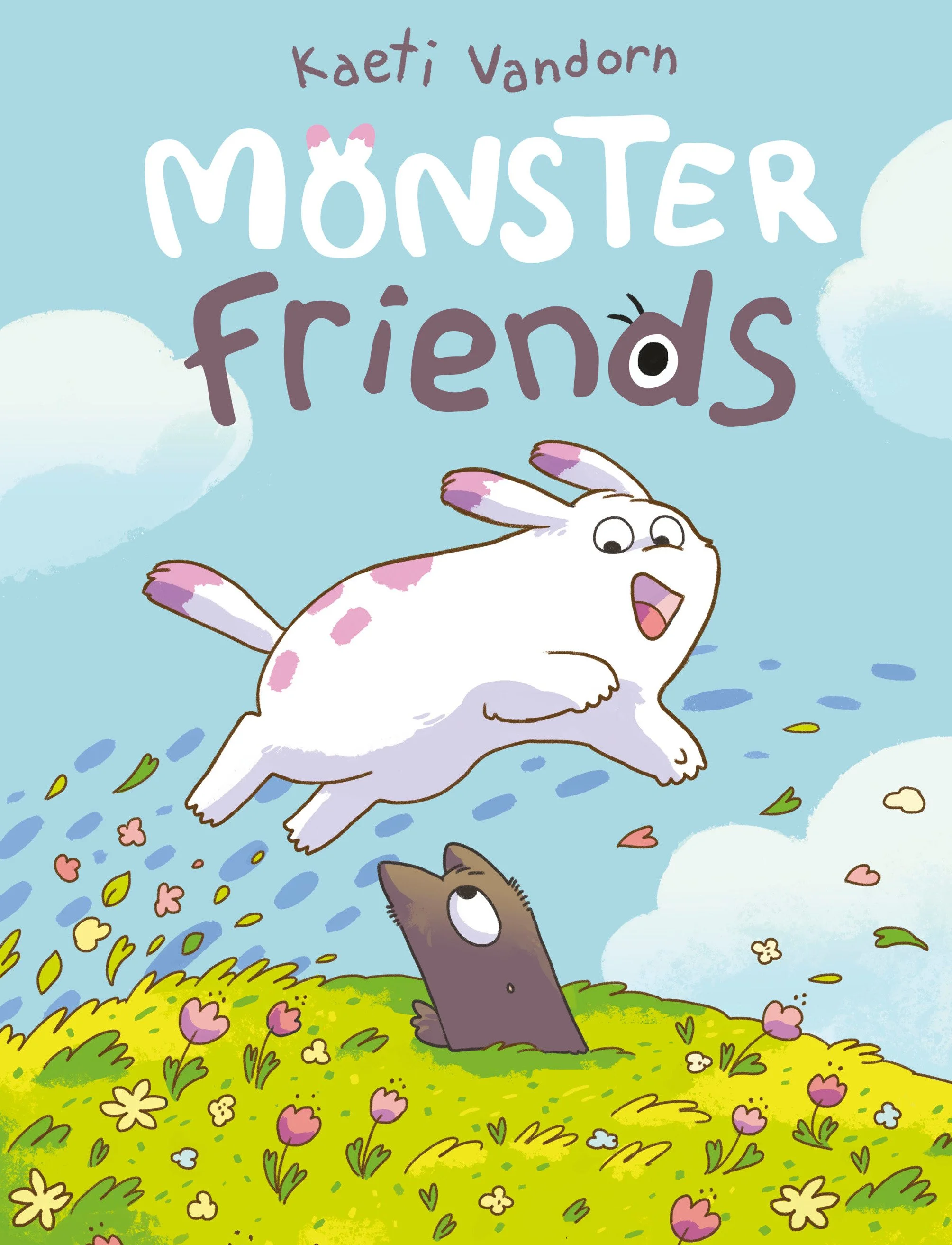 Children's book cover titled 'Monster Friends' by Kaeti Vandorn, featuring a white fluffy bunny with pink spots and an open mouth, jumping in the air over a grassy field with pink and yellow flowers, looking down at a brown mole peeking from the gras