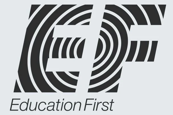 A black and white stylized maze design with the words 'Education First' underneath.