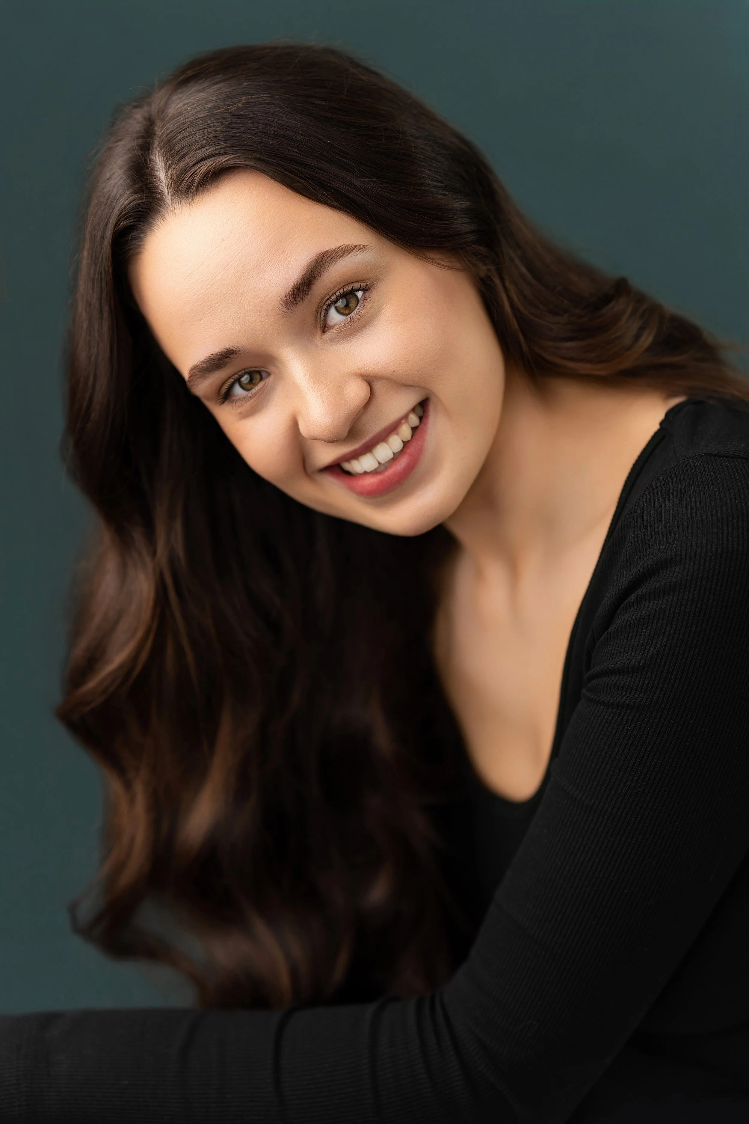 Professional female headshot portrait with a natural smile, photographed by Zsolt Santa Photography in Canterbury, Kent, UK