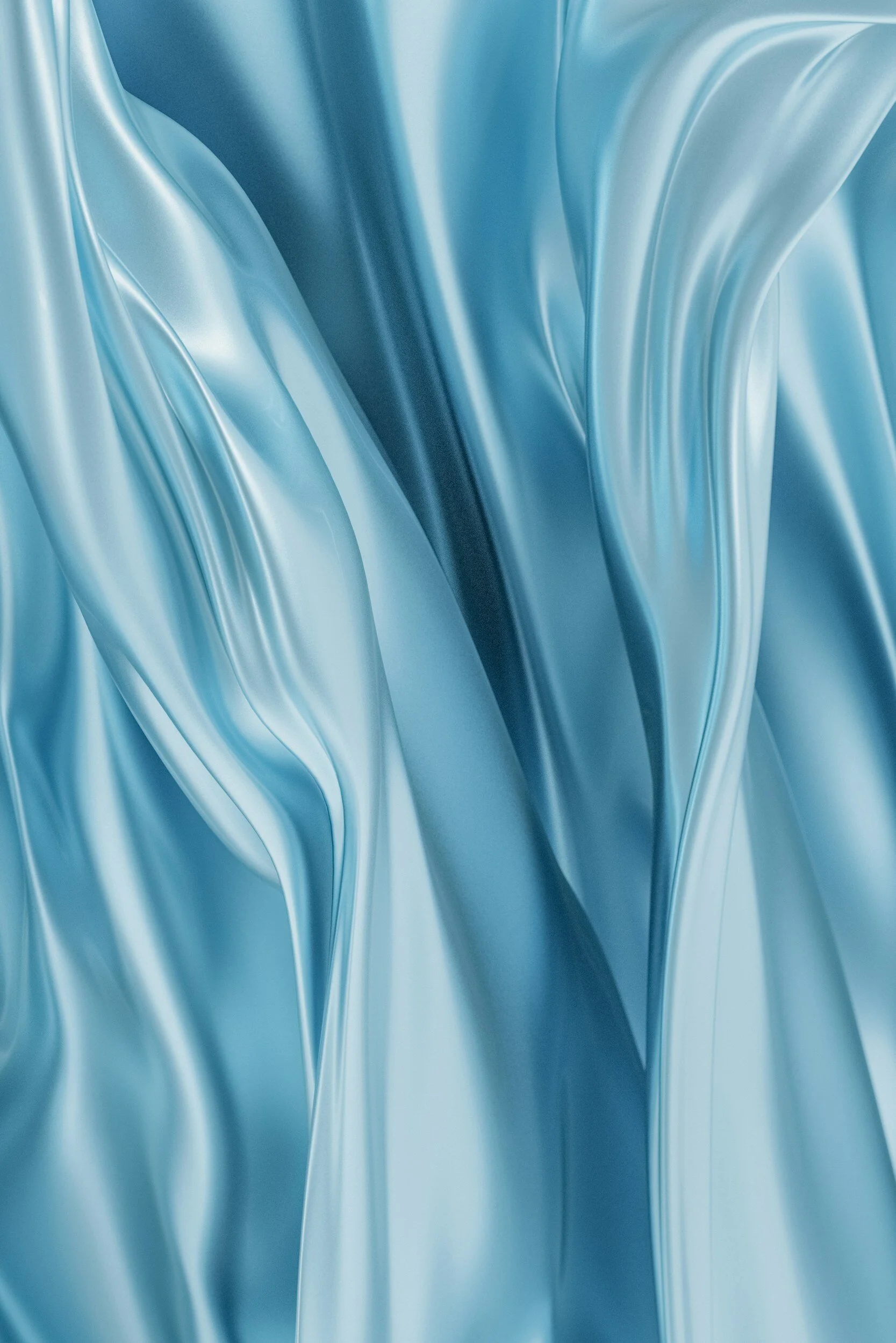 Close-up of smooth, shiny, flowing blue fabric with soft folds and curves.