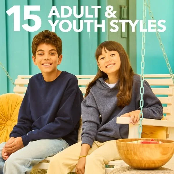 Two children sitting on a white swing bench in a colorful room, smiling, with the text '15 Adult & Youth Styles' at the top.