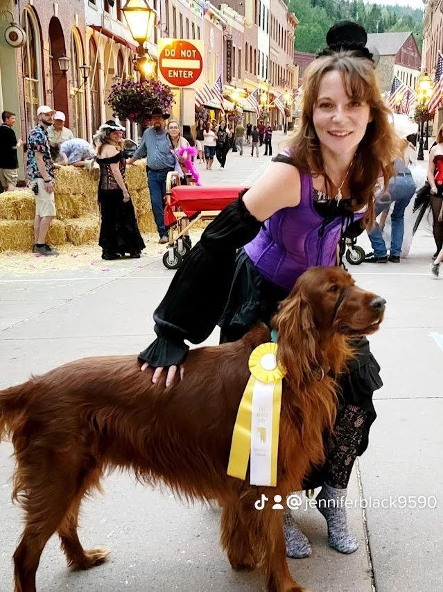 Author J. R. Black with her Irish Setter Seamus winning 3rd Place in the Lou Bunch Days costume contest in Central City, CO