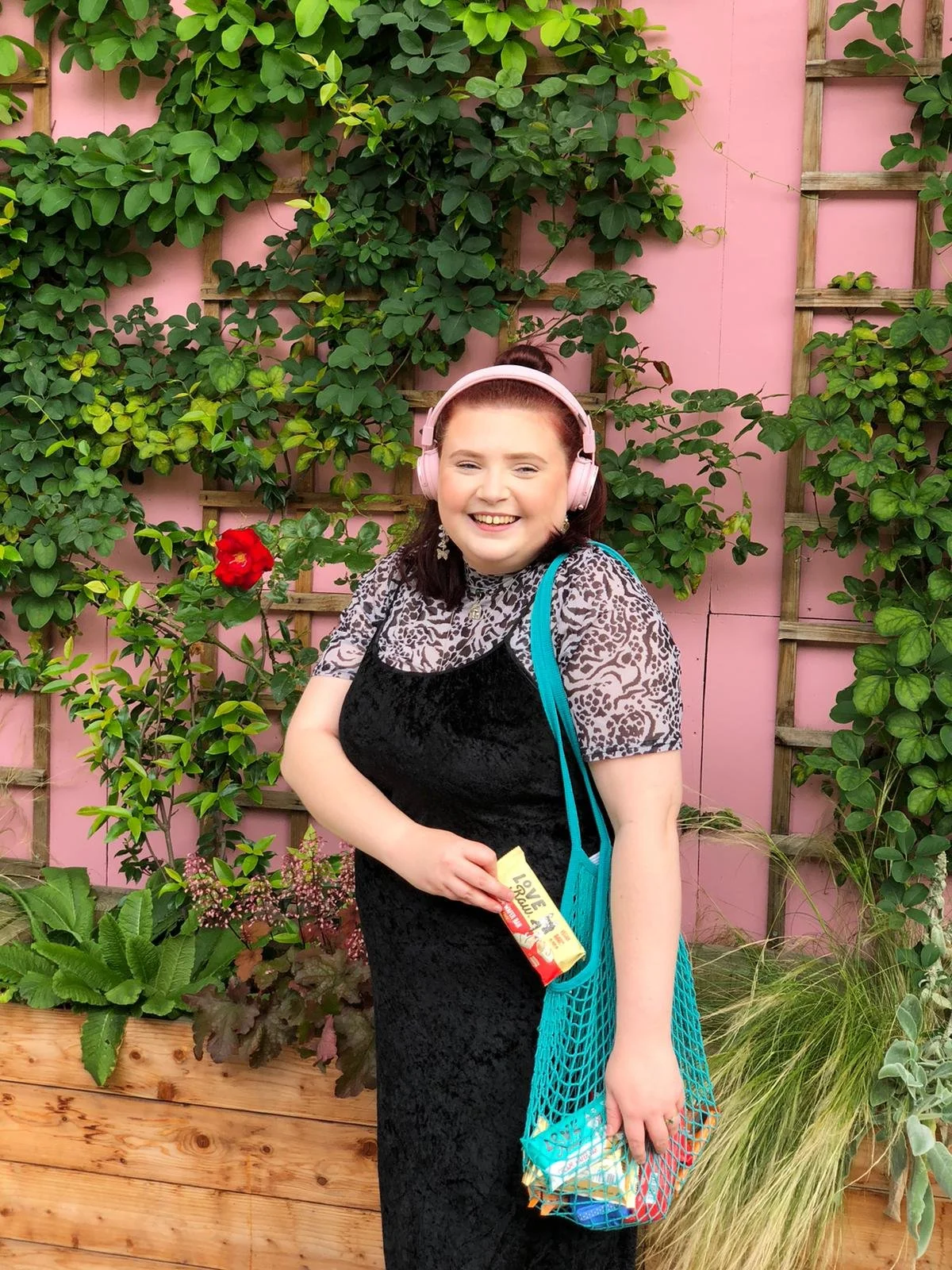 girl with a mesh top and long velvet black dress posing for a picture - freelance social media manager and content creator cheshire uk