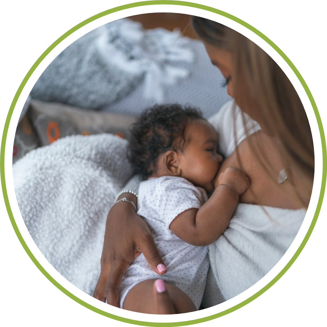 A postpartum doula supporting a mother during a late-night breastfeeding session in Cleveland, Ohio.