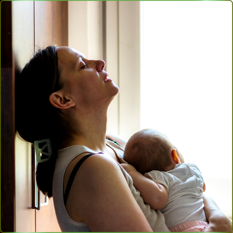 A Nurtured Foundation postpartum doula providing breastfeeding support to a new mother in her Lakewood, Ohio home.