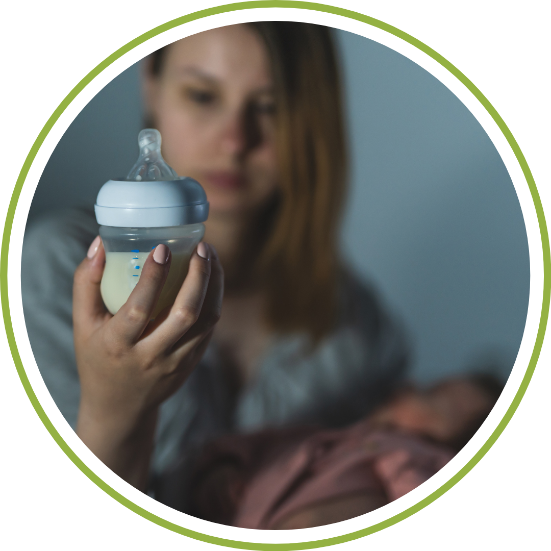 night nurse in Cleveland feeding newborn at overnight shift