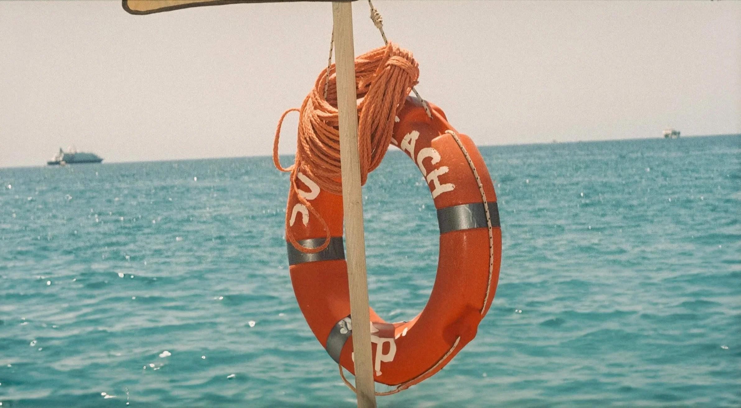 "Lifeline"
A lone lifebuoy against turquoise waters, Amalfi, Italy.