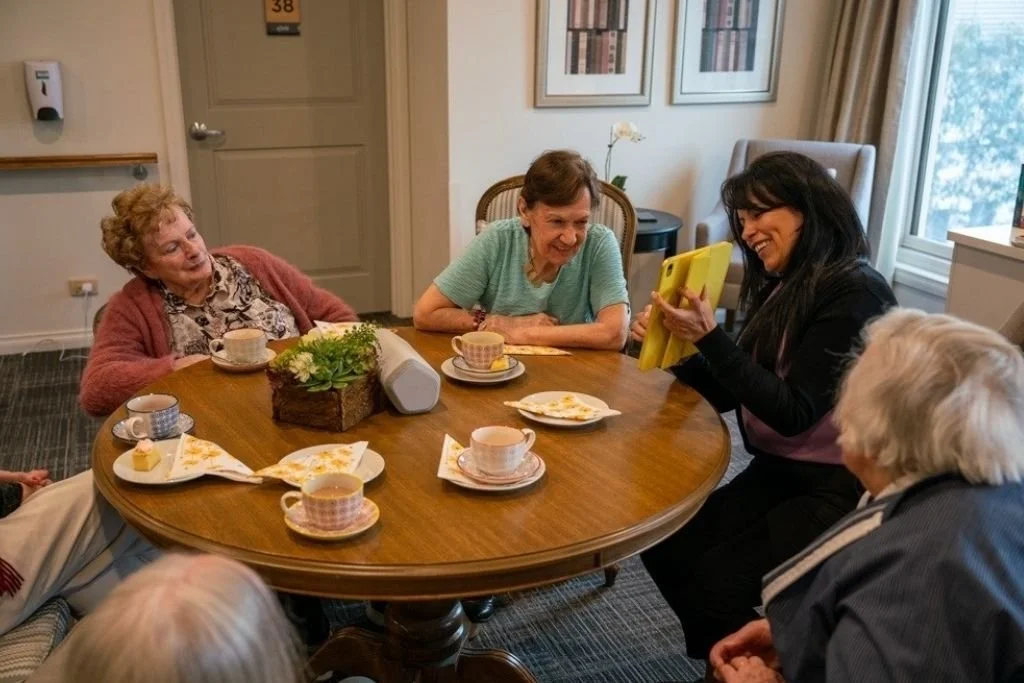 Elders in an aged care facility enjoying the TeaTime app