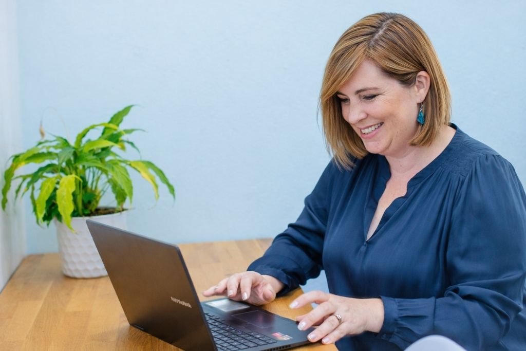 Barbara Brangan helping a customer secure a grant