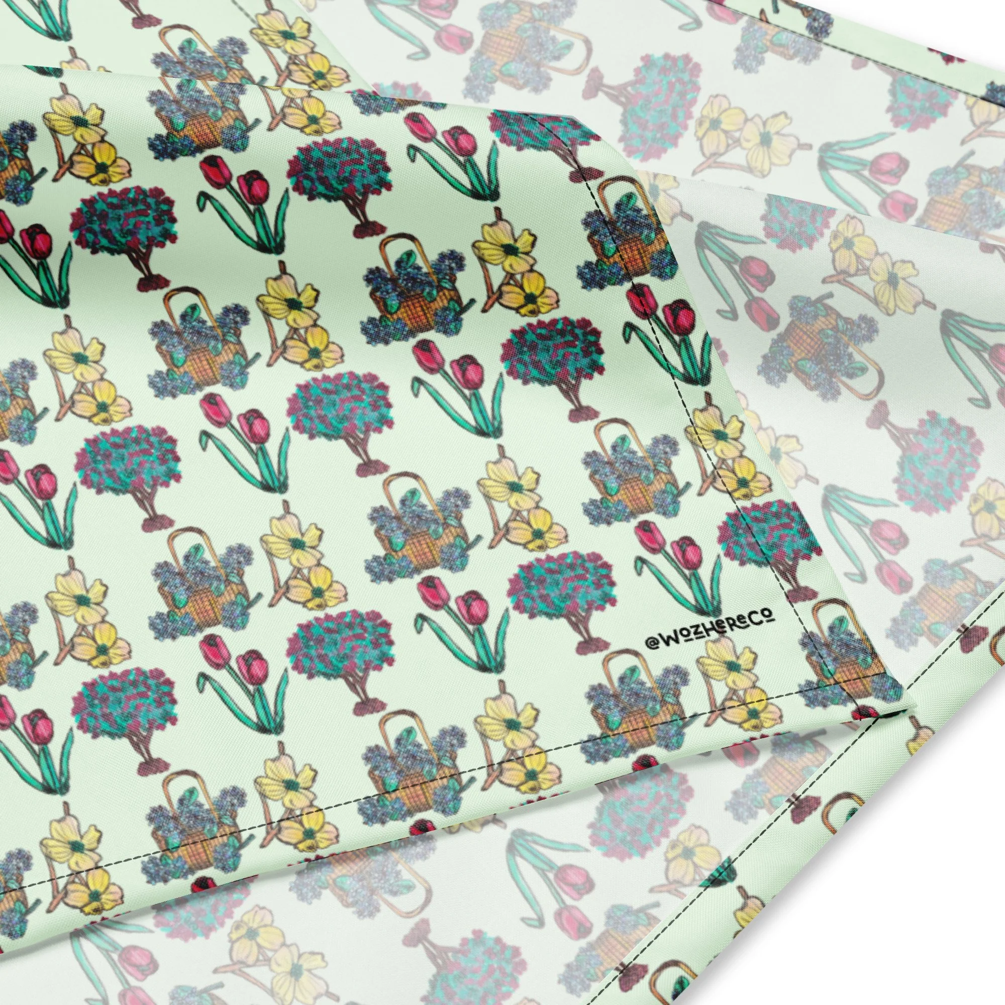 Hand-painted watercolor hydrangeas, tulips, dogwood, and crepe myrtle flowers printed on a dog bandana.