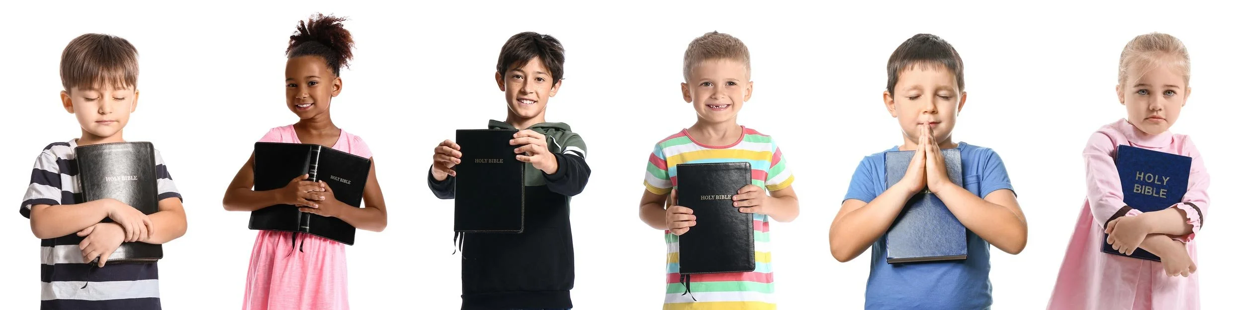 Six children holding or praying with Bibles against a white background.