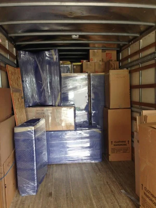 White glove movers assembling furniture in Maine