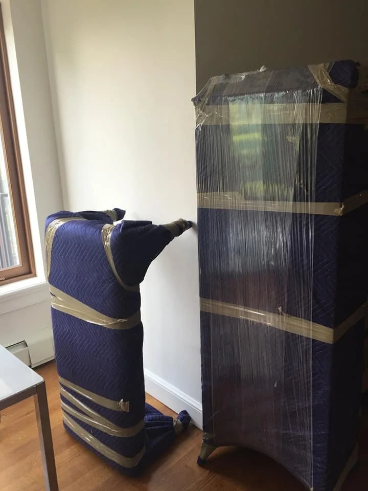 White glove movers assembling furniture in Maine