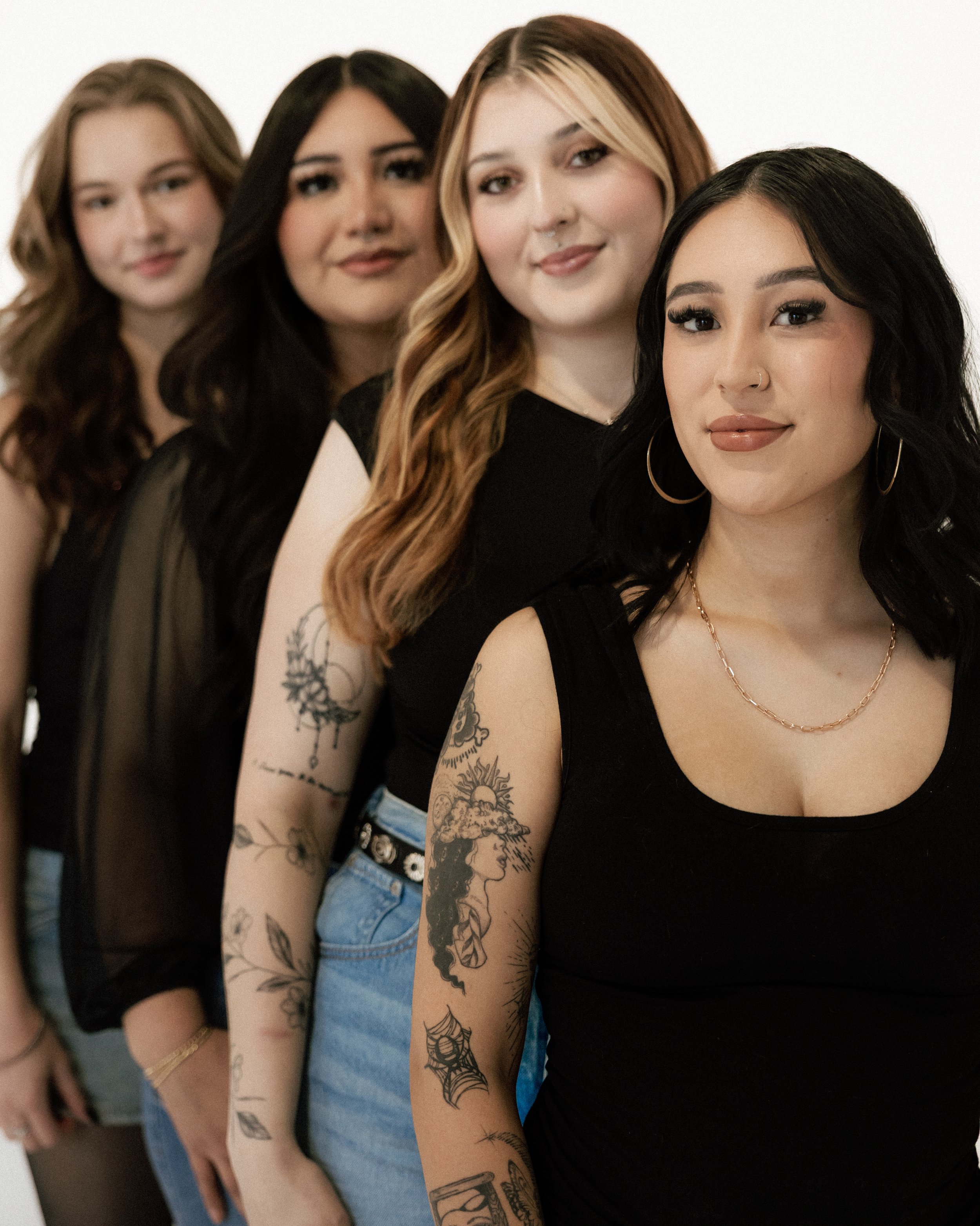 4 hairstylists standing in a row sister hair studio new mexico