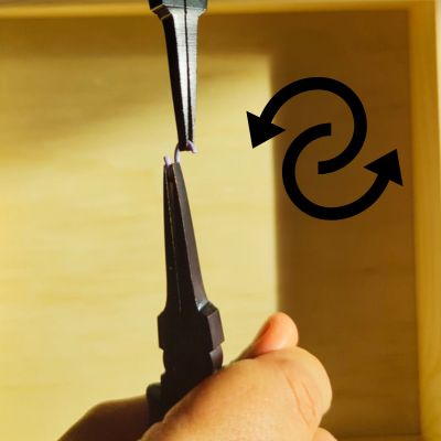 4. Slowly twist each side away from one another. This is how we open the jump ring.