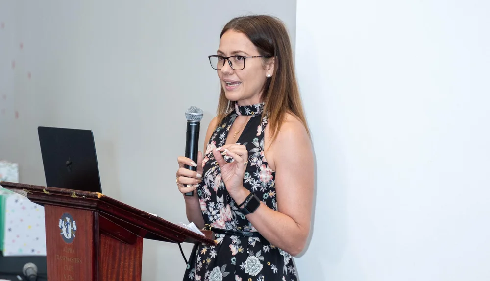 Amanda Boyce speaking at podium