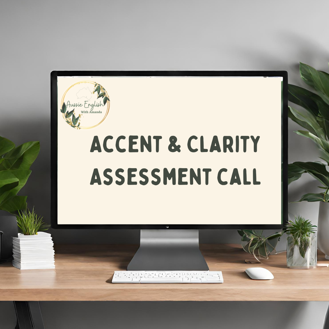 Computer screen displaying 'Accent & Clarity Assessment Call' with a logo in the top left corner, on a wooden desk with green plants nearby.