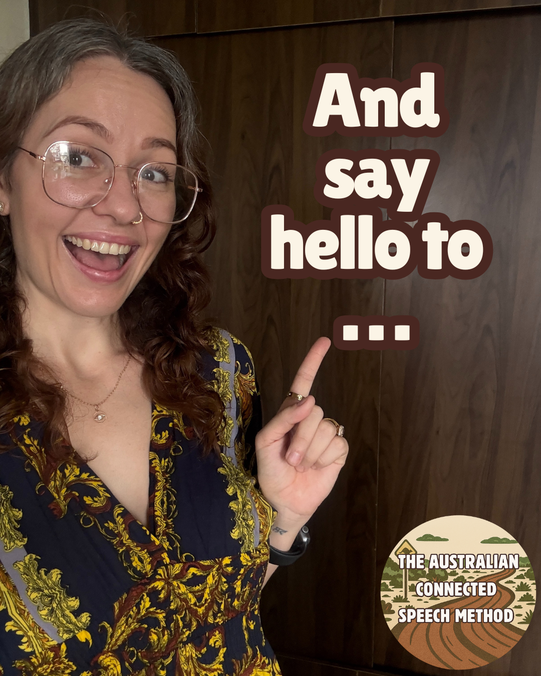 A smiling woman with glasses and curly hair wearing a patterned top, pointing at text on a wooden wall that reads 'And say hello to ...'. A circular logo in the bottom right corner says 'THE AUSTRALIAN CONNECTED SPEECH METHOD' with a stylized landscape background.