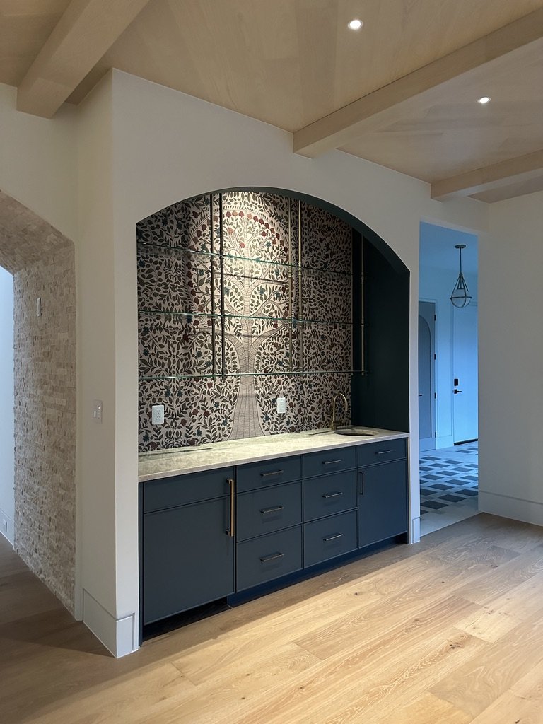 Traditional Madhubani art style Anant wallpaper featuring a sacred tree of life in a home bar area.