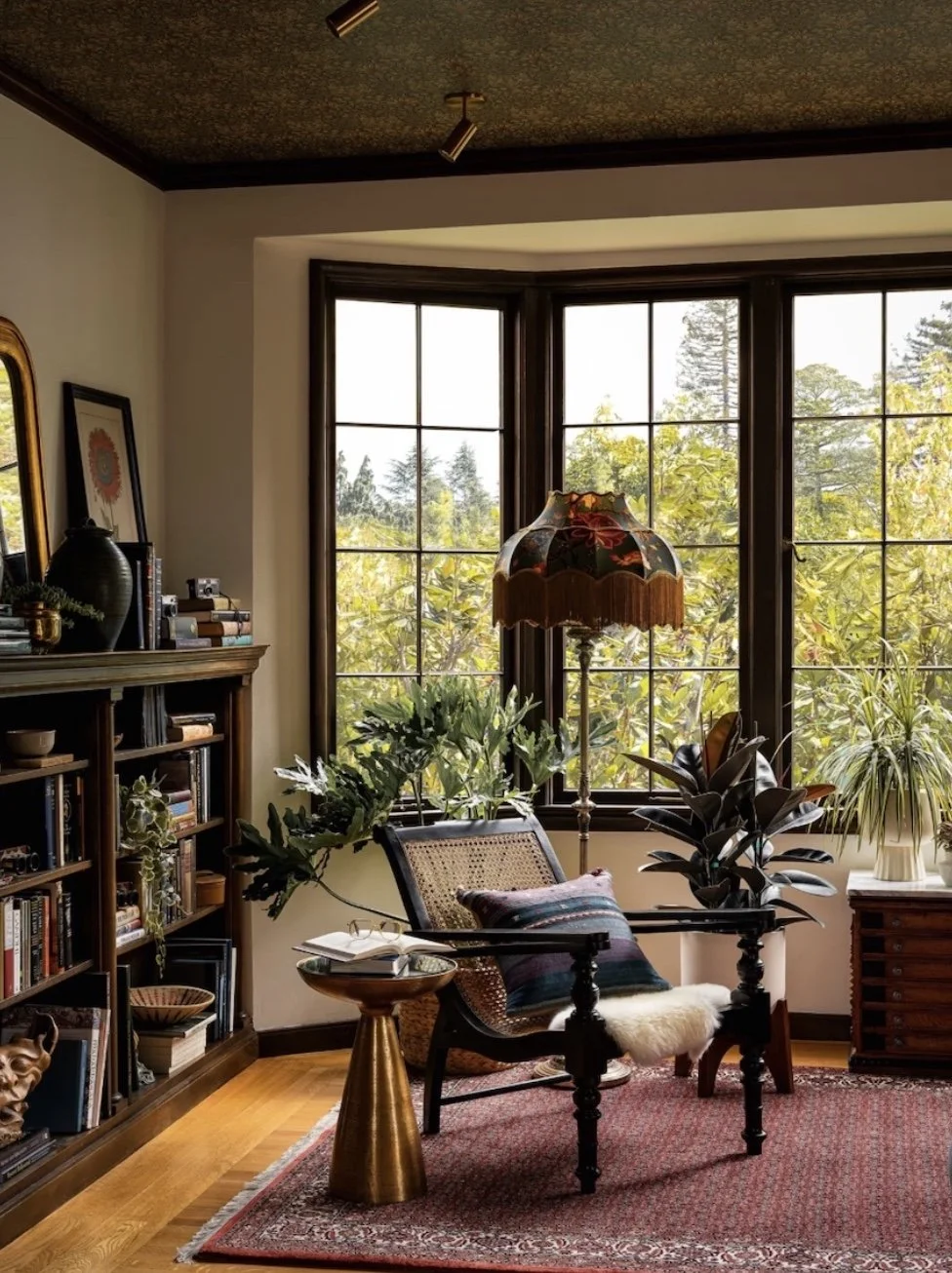 British Colonial style plantation chair with woven caning in a bright, tranquil room.