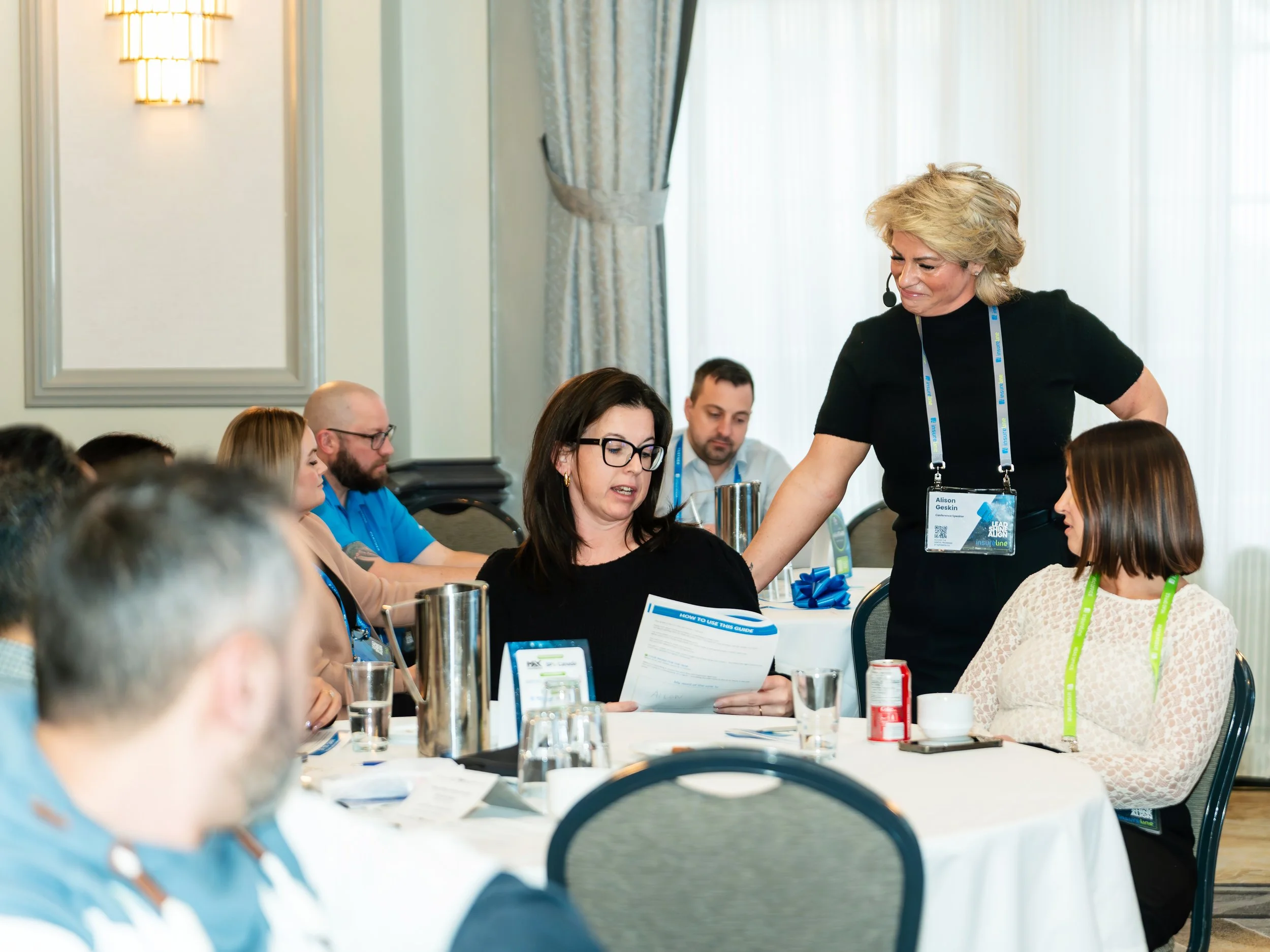 Alison Geskin in conversation with a client leadership team