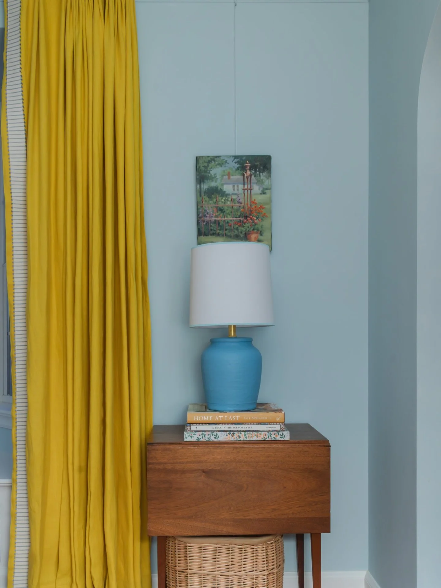 I love little vignettes like this. The yellow brings this punch of energy against the blue lamp and wall, then the wood, wicker, and books ground everything back down. 

And honestly, if you&rsquo;ve ever wondered why you love certain photos so much,