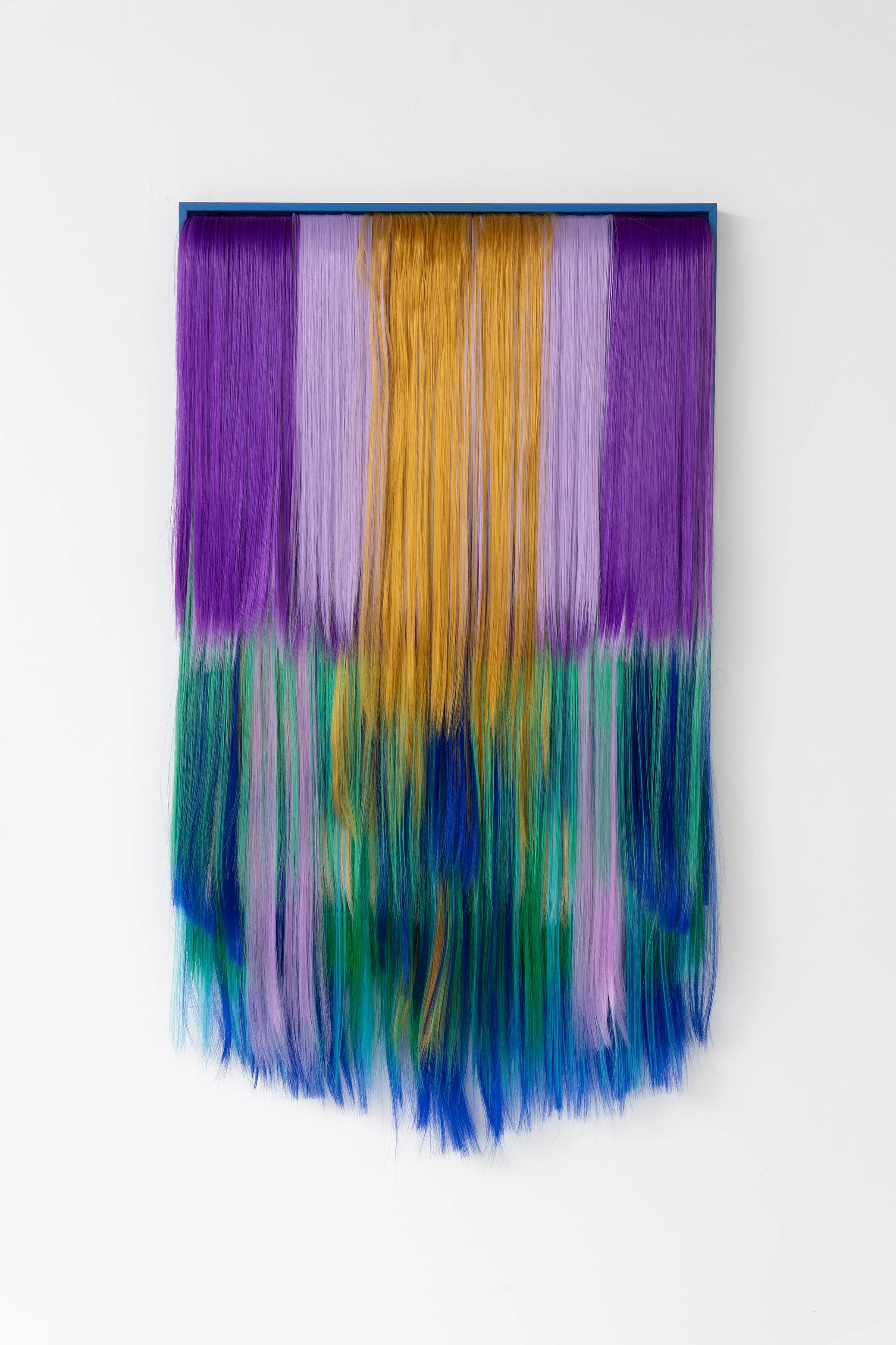 Untitled (Harriet), 2025.
Acrylic hair, MDF, canvas, wooden frame,
63 x 114 cm