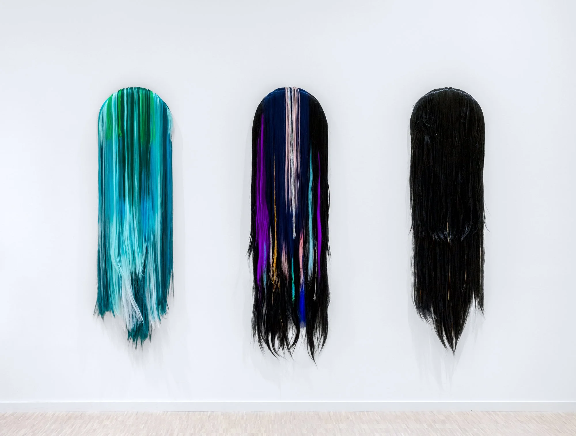 "5D Ambassadors VII-IX» 2021-2025    
Acrylic hair on canvas and MDF
40 x 4 x 125 cm