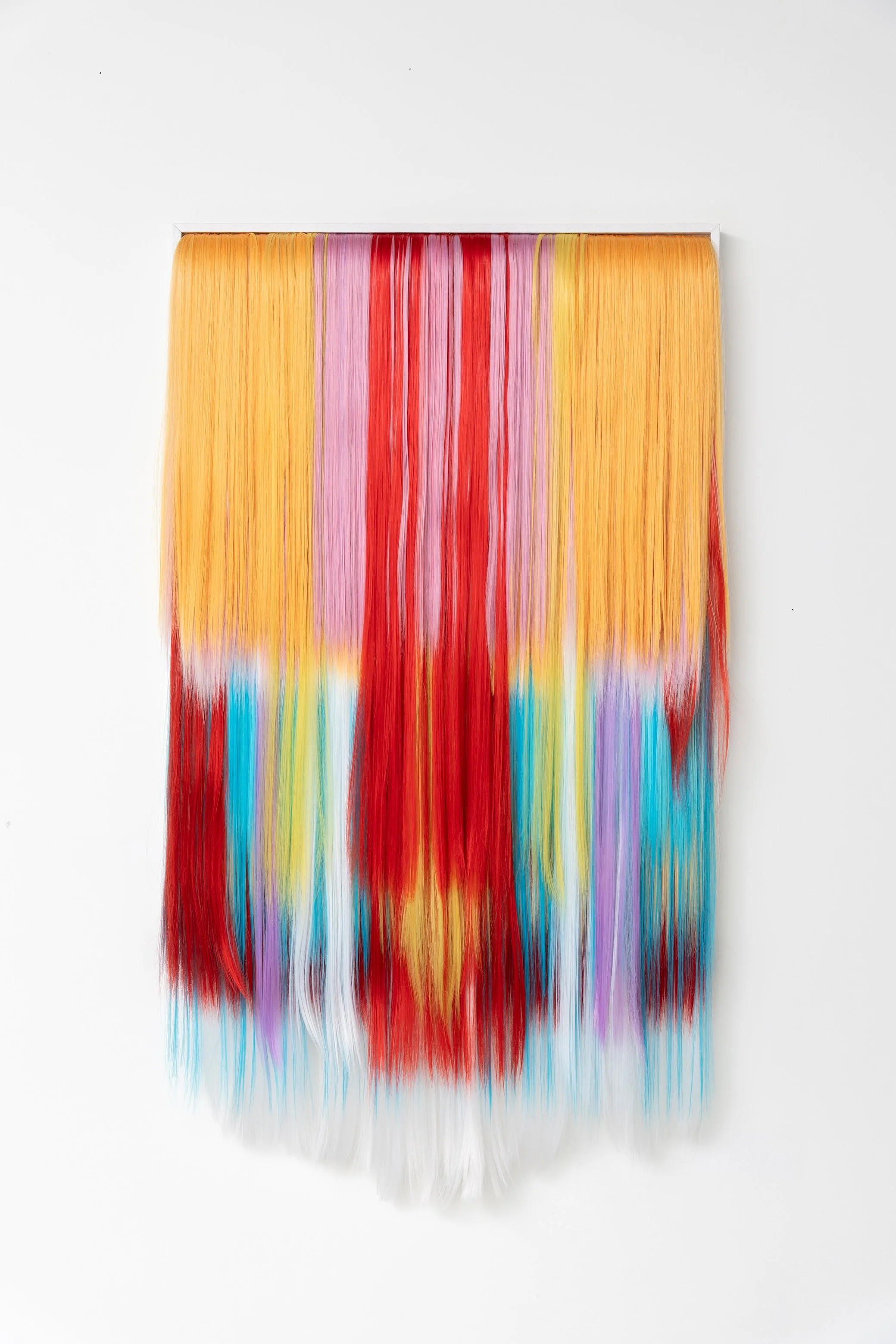 Untitled (Helen), 2025,
Acrylic hair, MDF, canvas, wooden frame,
63 x 114 cm