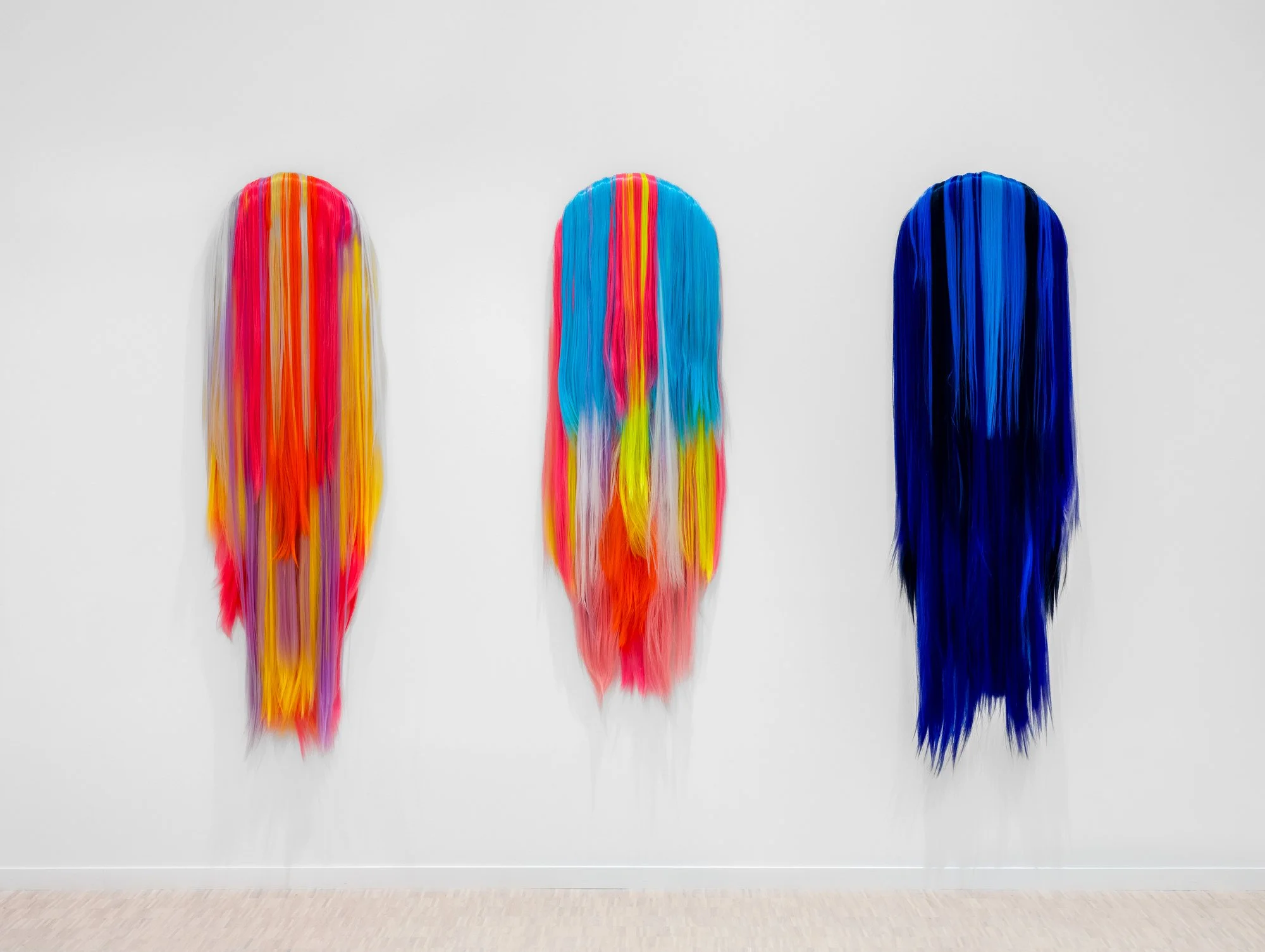 "5D Ambassadors IV-VI» 2021-2025    
Acrylic hair on canvas and MDF
40 x 4 x 125 cm