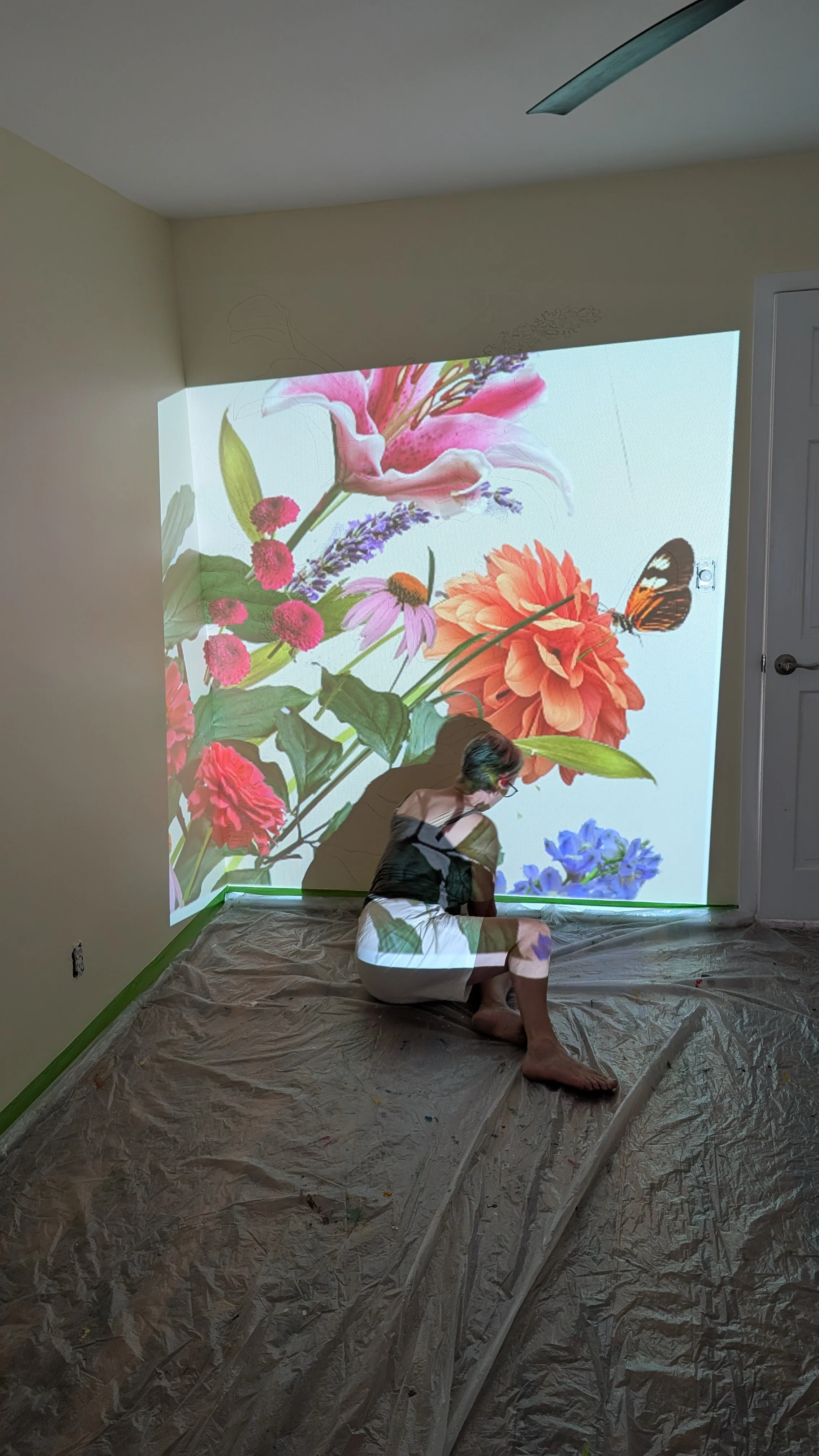 Mum helping sketch up dahlia on wall art