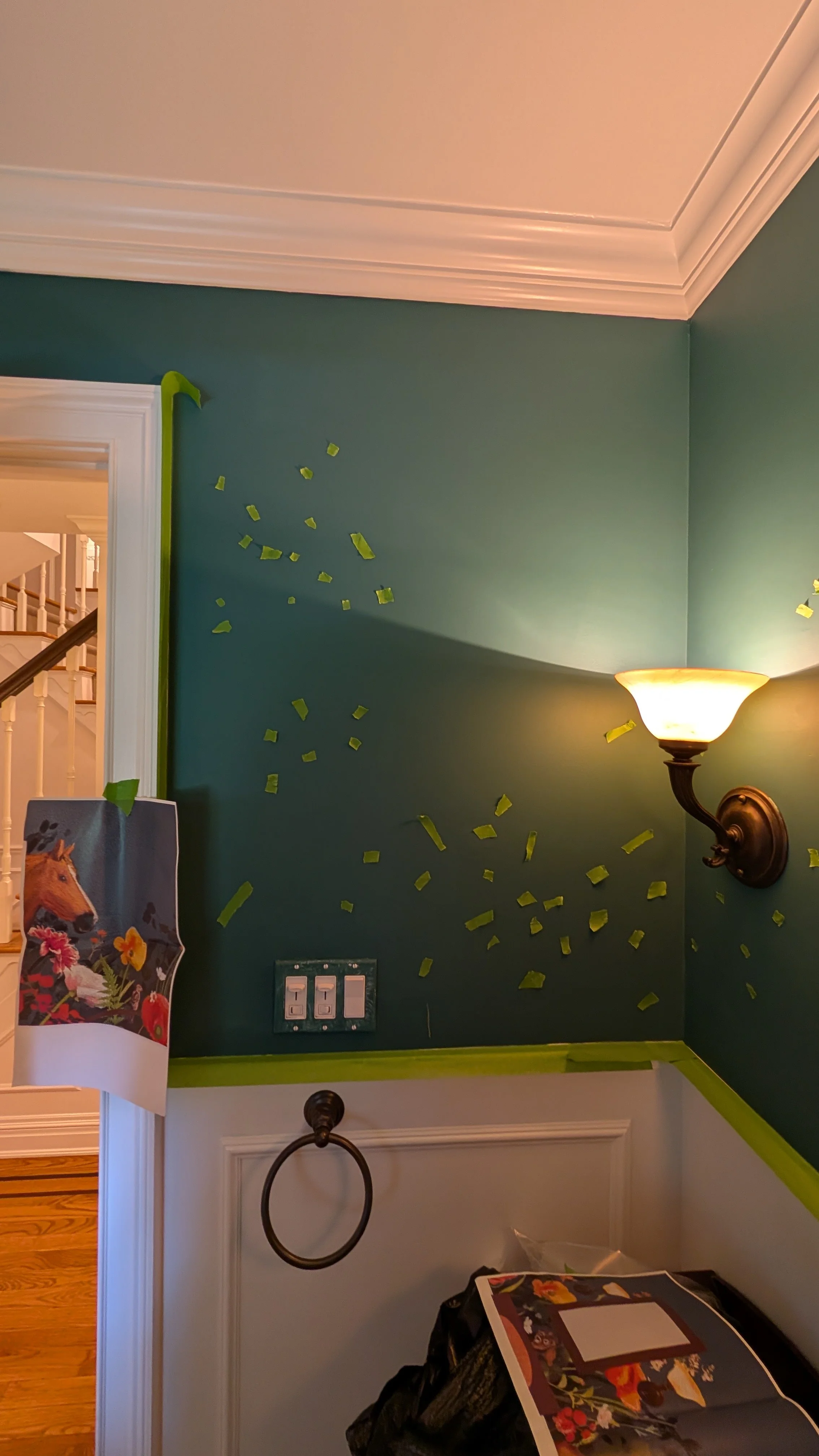 Initially mapping out the custom NYC bathroom mural using tape