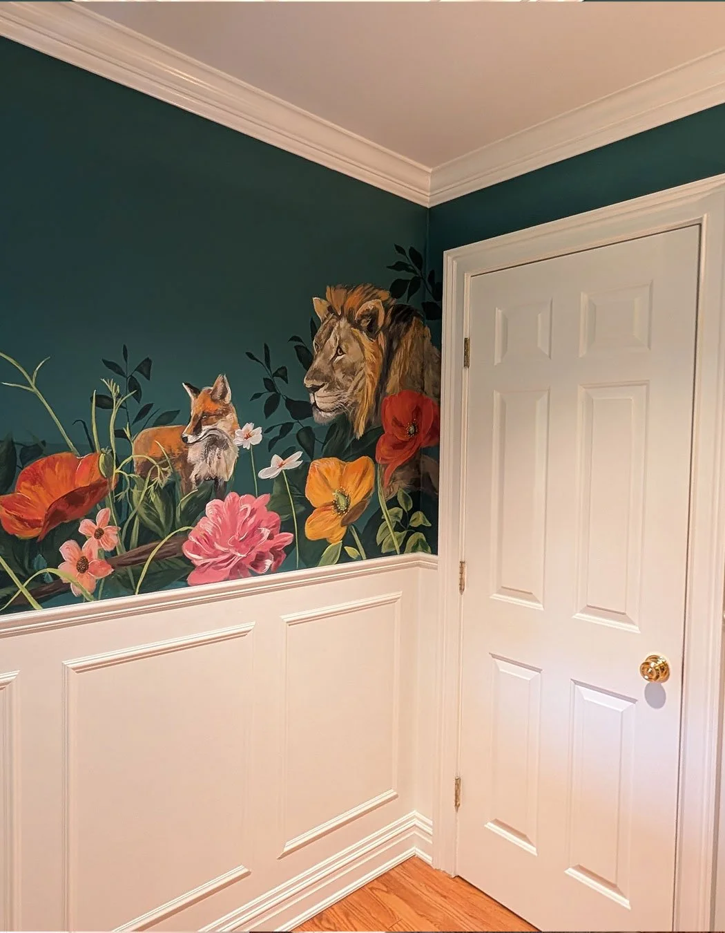 Lion, fox and wildflowers on a teal background, a detail from a NYC mural