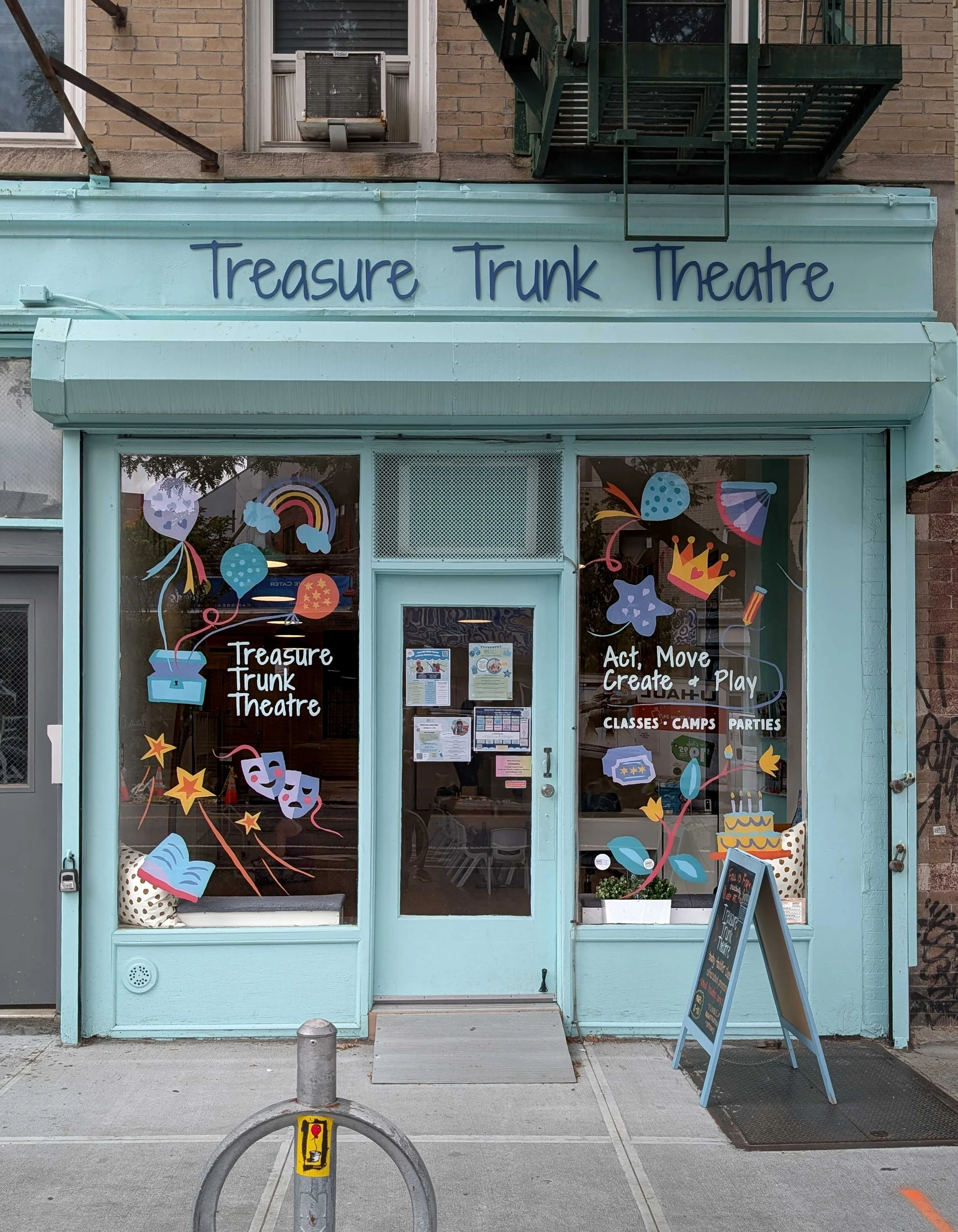 After image of Prospect Heights theatre window with a colourful hand-painted mural 
