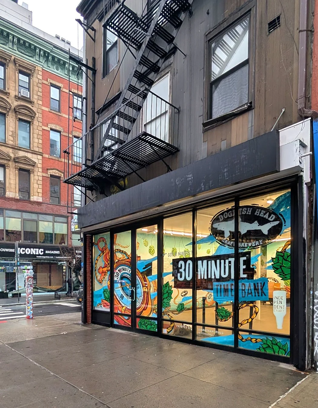 Hand-painted branded window mural for beer brand