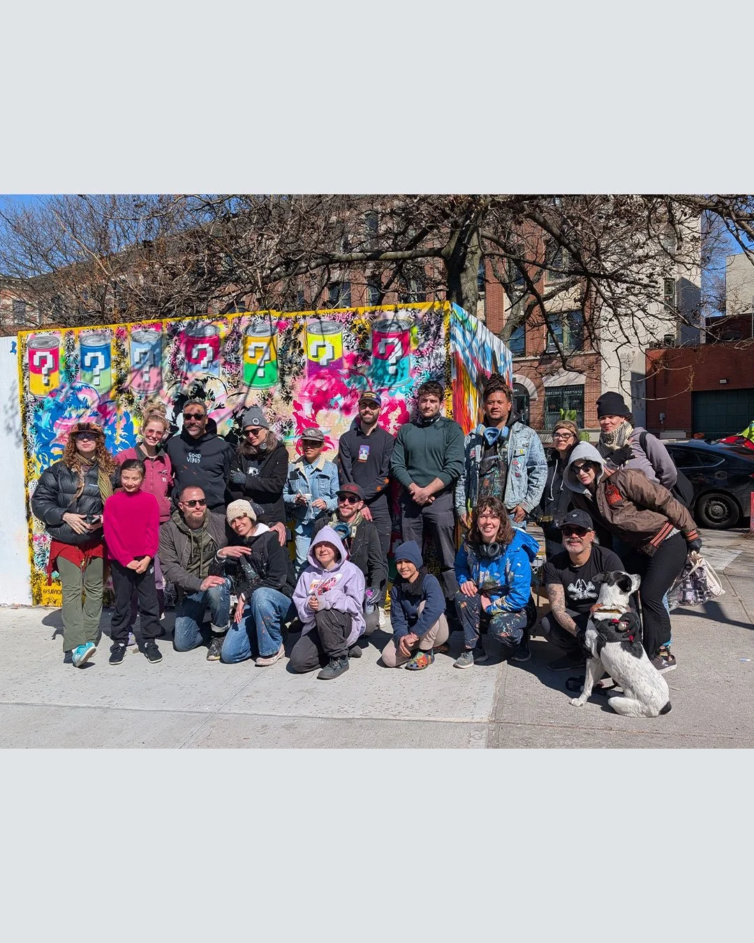 Shot of the team of artists who worked together to paint the blocks on Washington Street, Prospect Heights