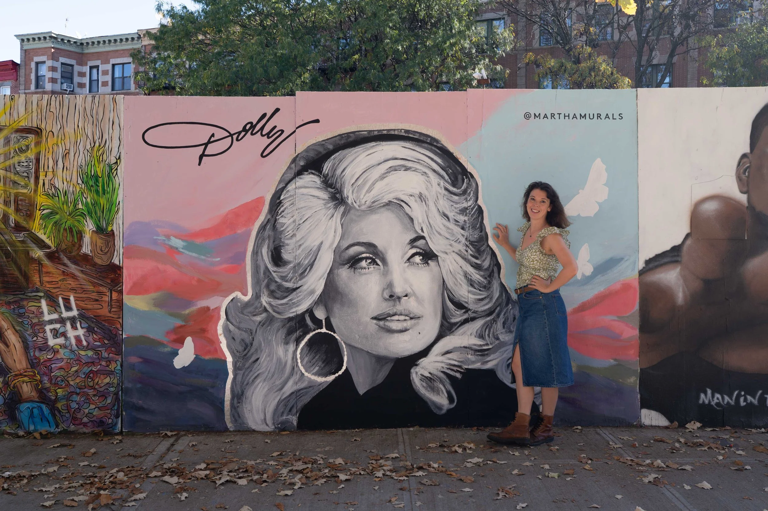 martha-antonelli-in-front-of-black-and-white-hand-painted-portrait-mural-in-prospect-heights.jpg
