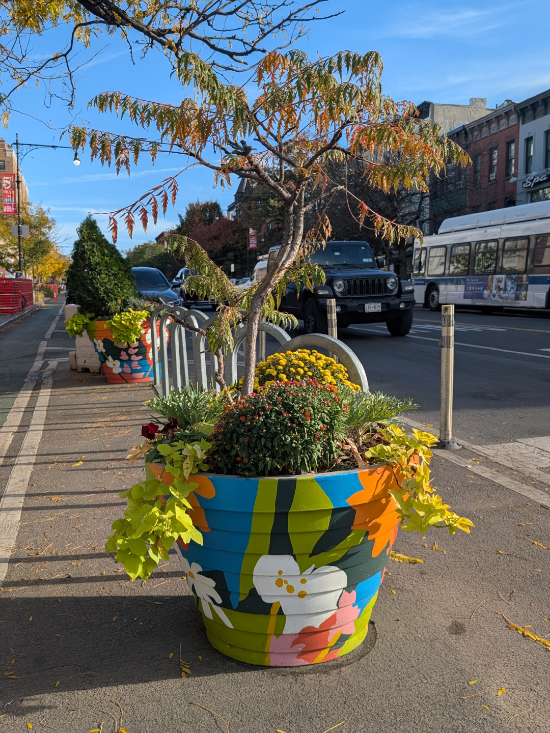 9th-st-plant-pot-hand-painted-with-bright-colours-in-a-botanical-design-in-brooklyn.png