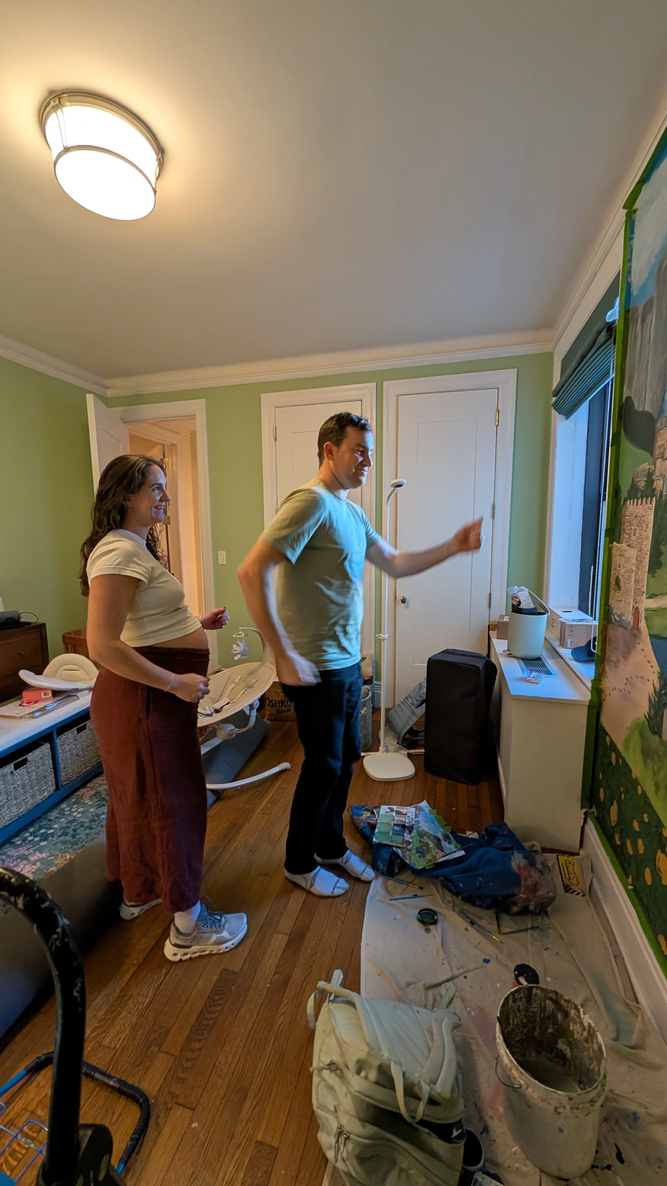 The clients posing to be hand-painted into the children's bedroom