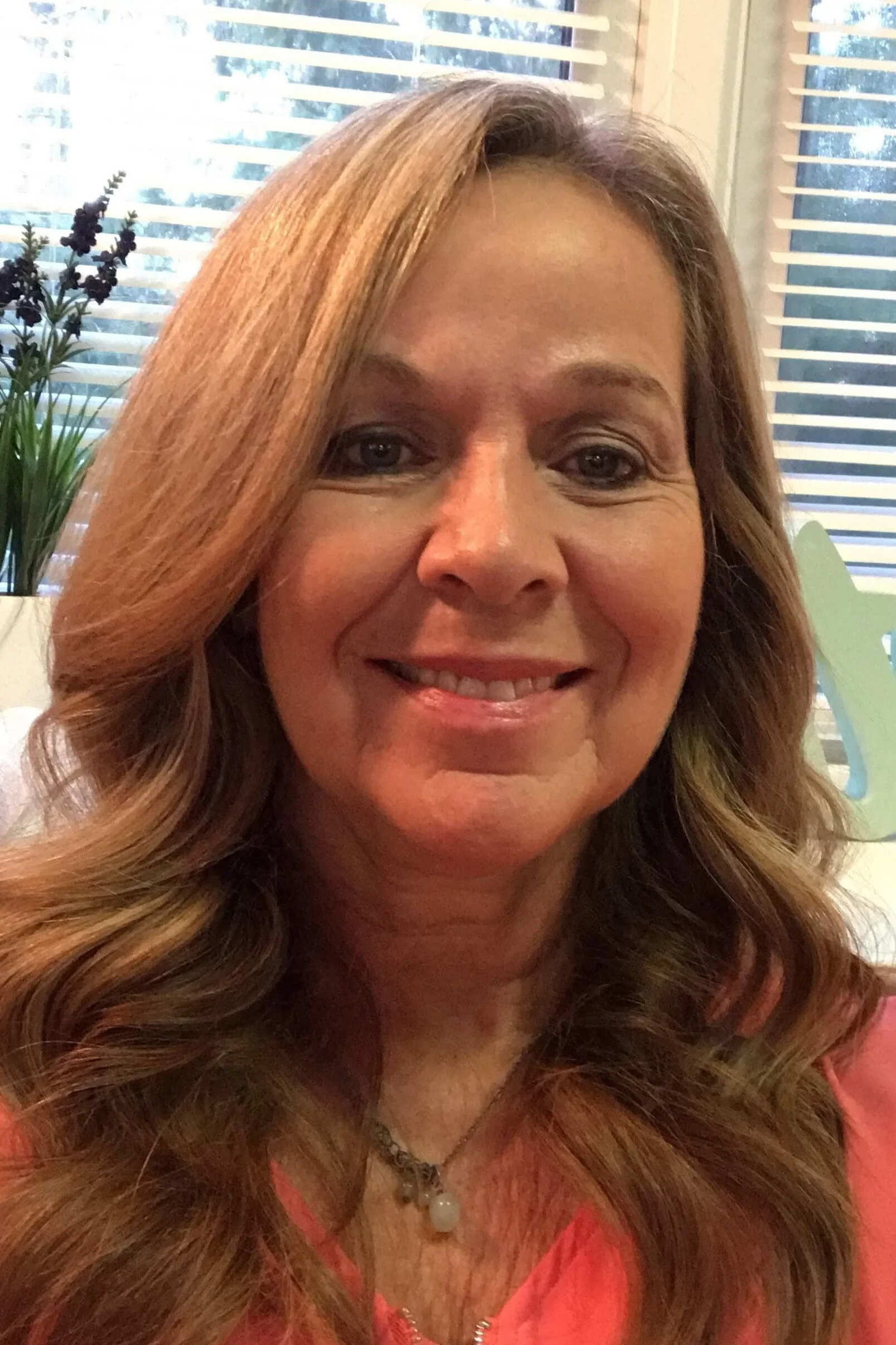 Headshot of May Scholle, LCSW, therapist at Sunflower Radiance Counseling.