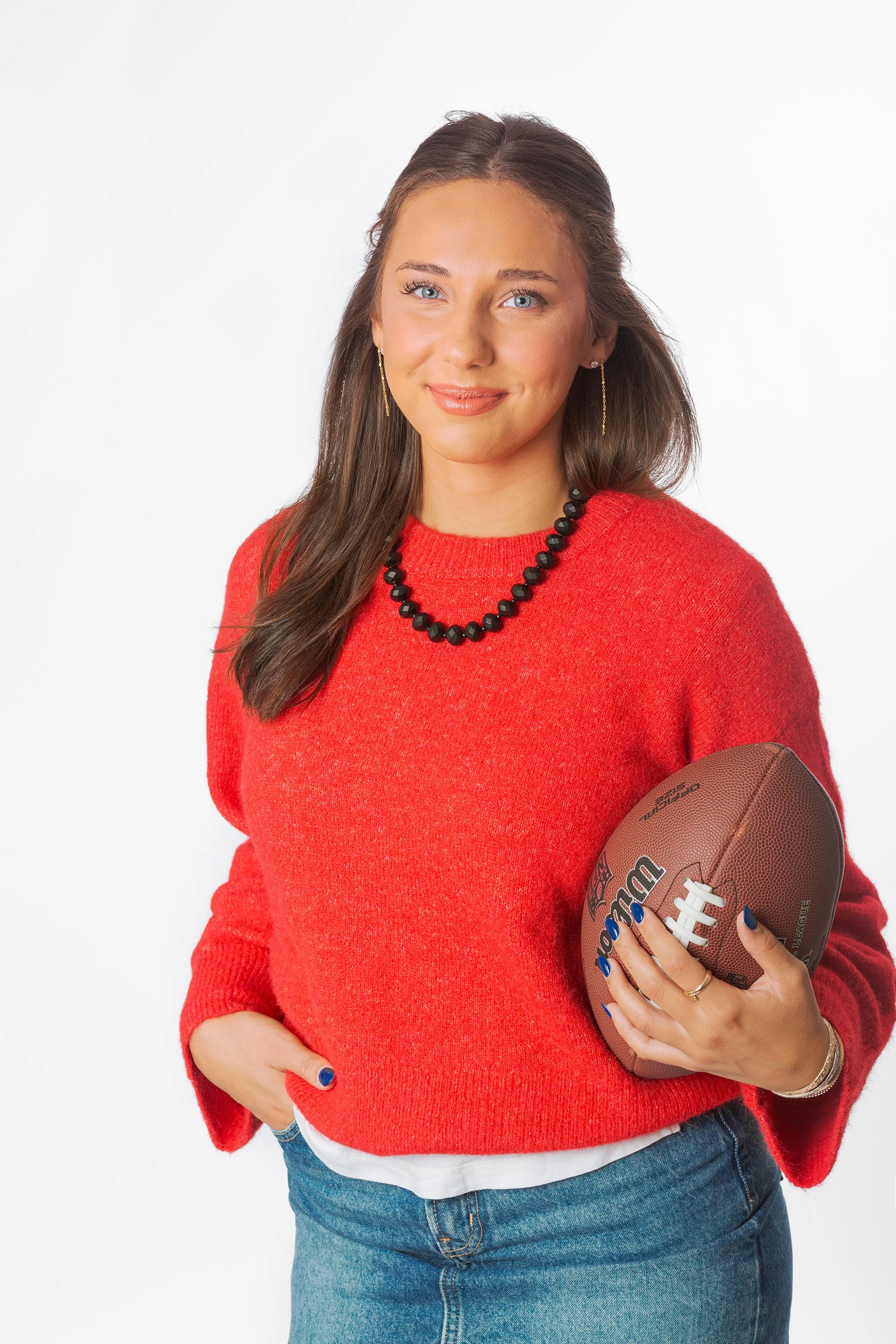 studio-white-background-portrait-young-woman-holding-football