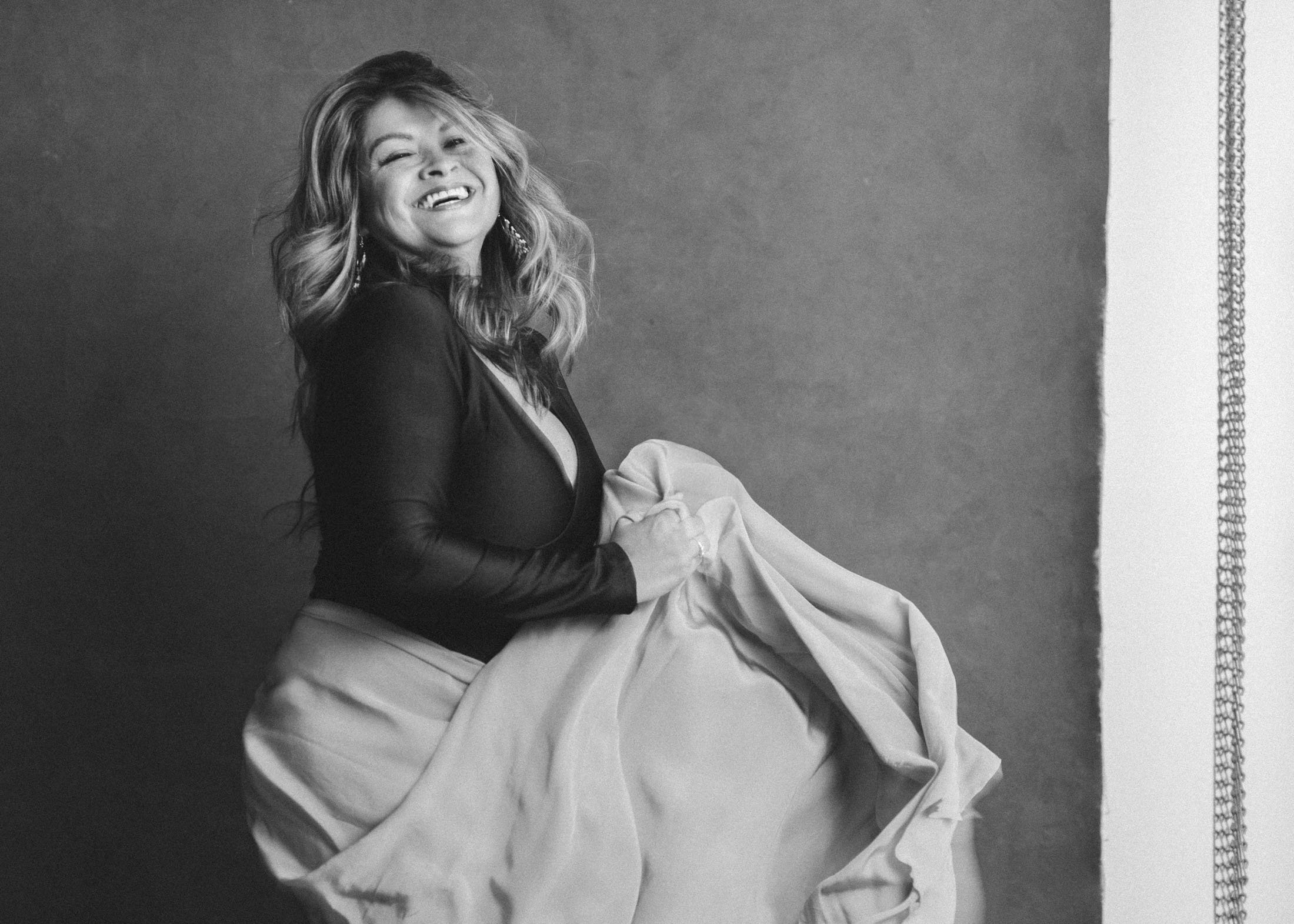 Black and white studio portrait of a confident woman over 40, Los Angeles