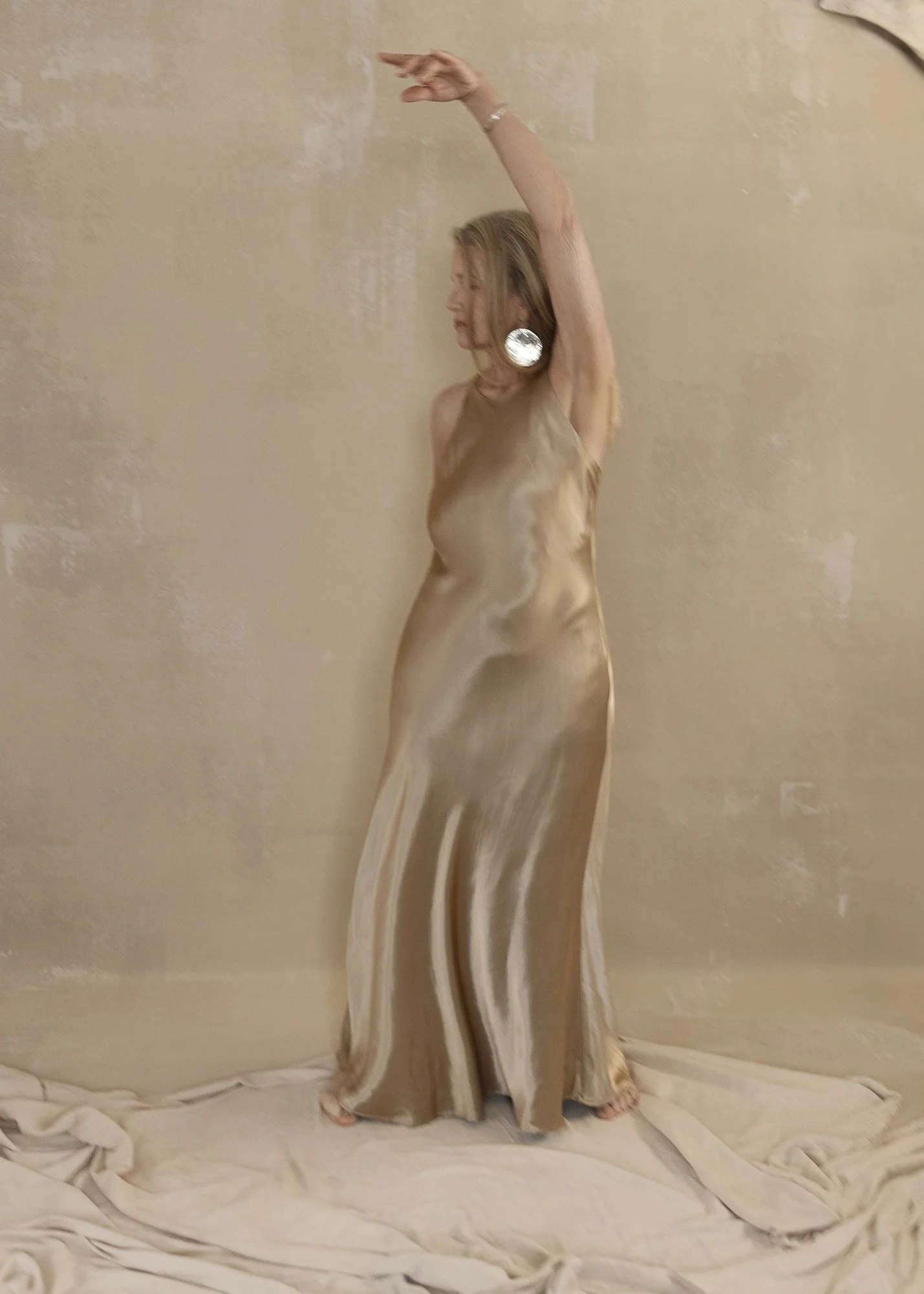 woman over 60, gold dress, luxury portrait session, barefoot-glam experience
