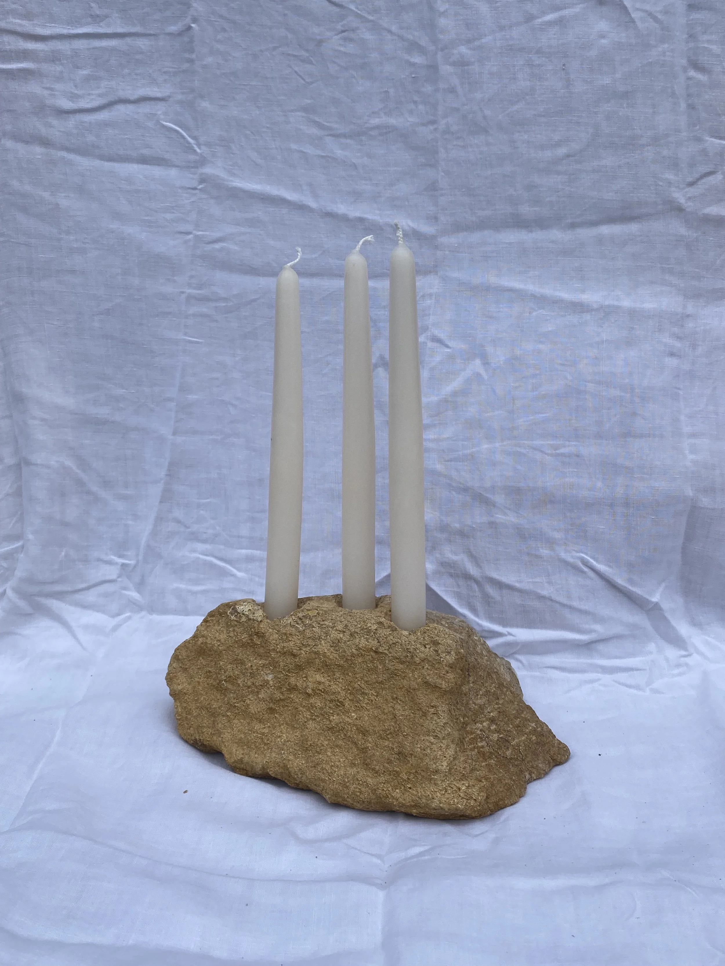 'Triple Candle Holder' Hamstone, 2026. Please seek A New Tribe's website for more details. 