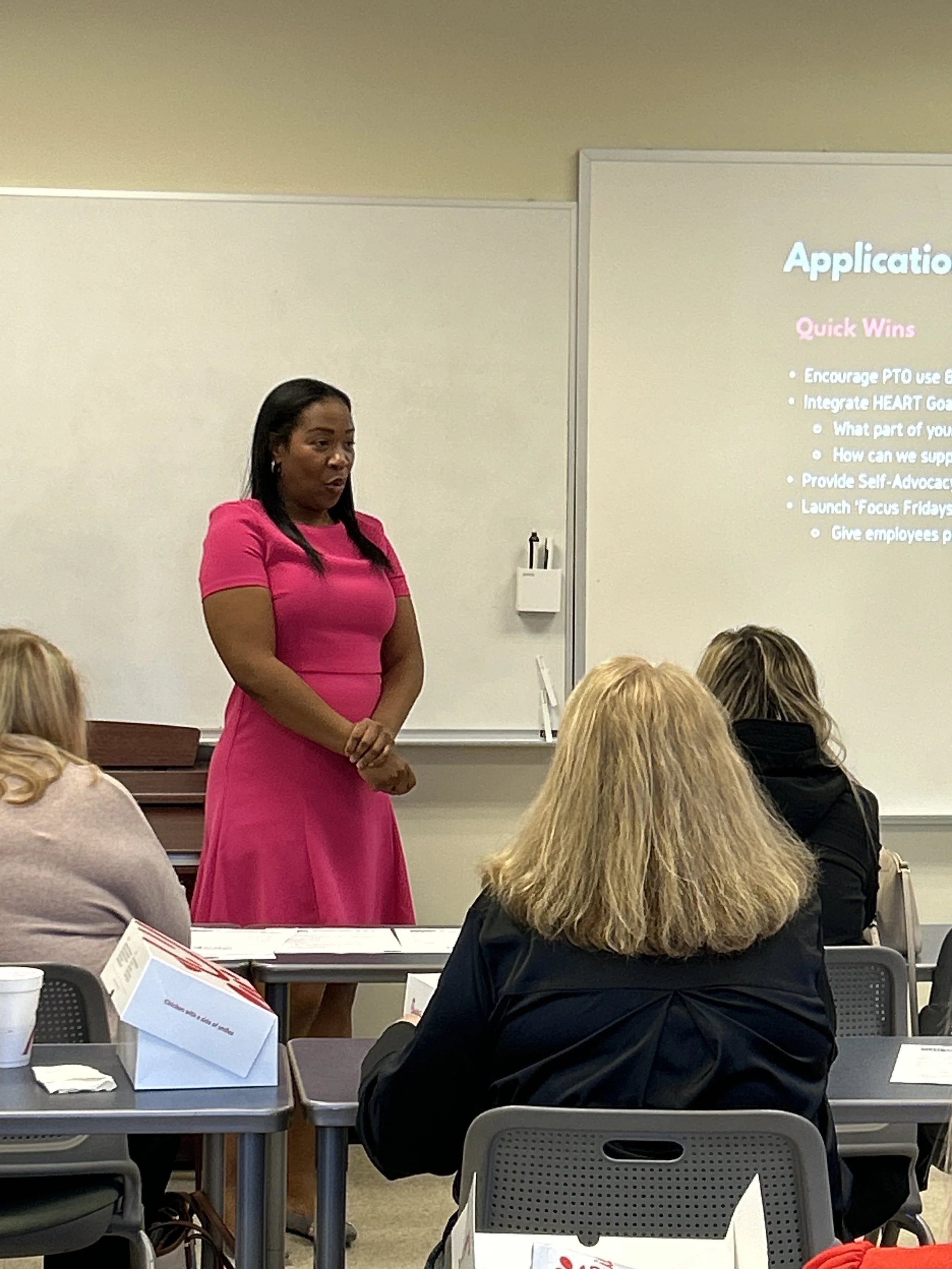 Charlene Ridley leading a HEART Goals leadership workshop for a team