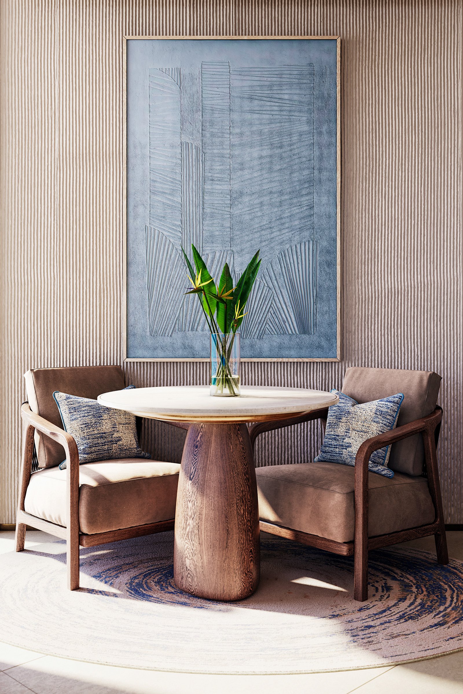 A round wooden table with a vase of green leaves and four upholstered chairs around it, set against a wall with textured vertical stripes and a large abstract painting.