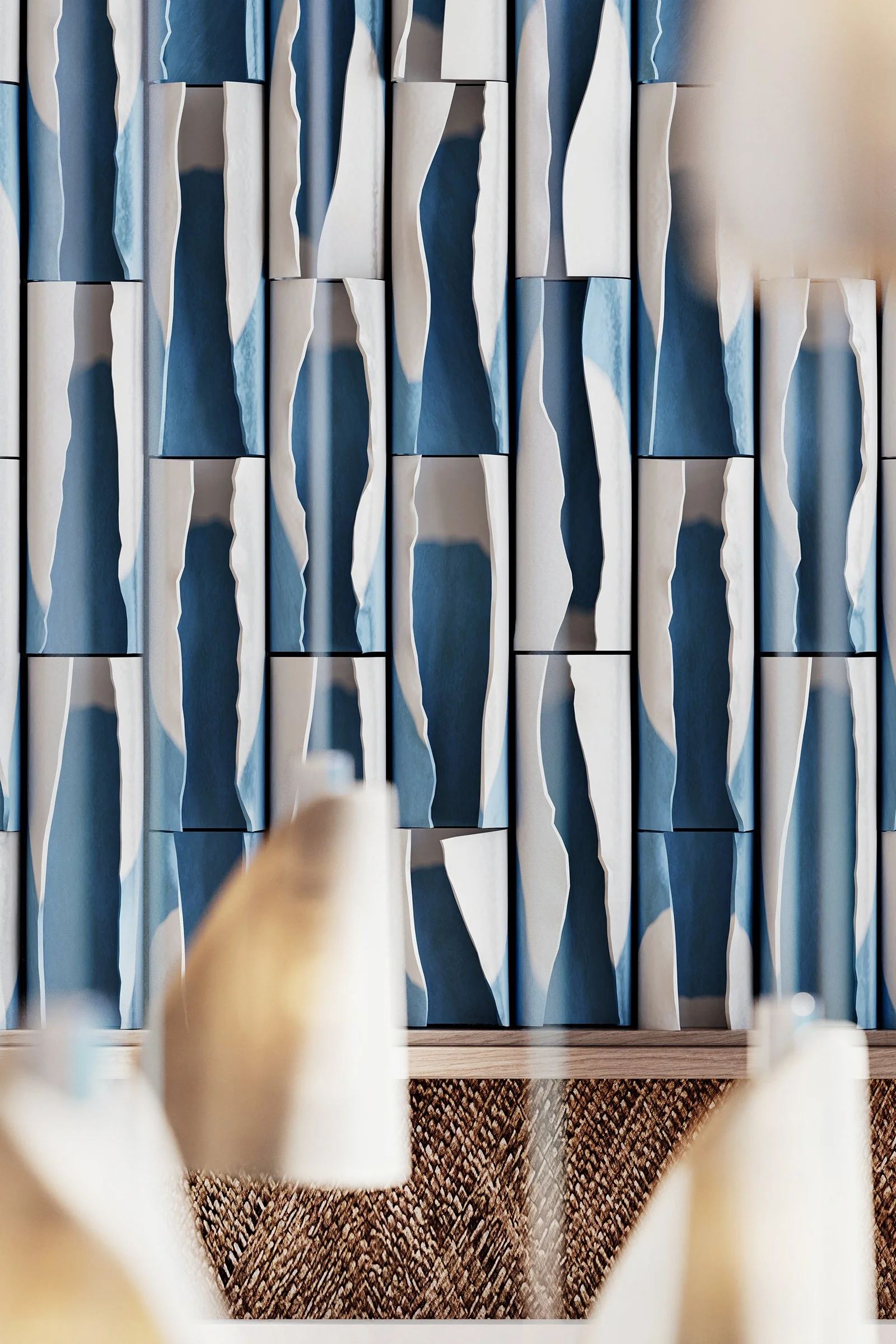 A chess game with several pawns in the foreground, all out of focus, while the background shows a textured wall with vertical, decorative panels.
