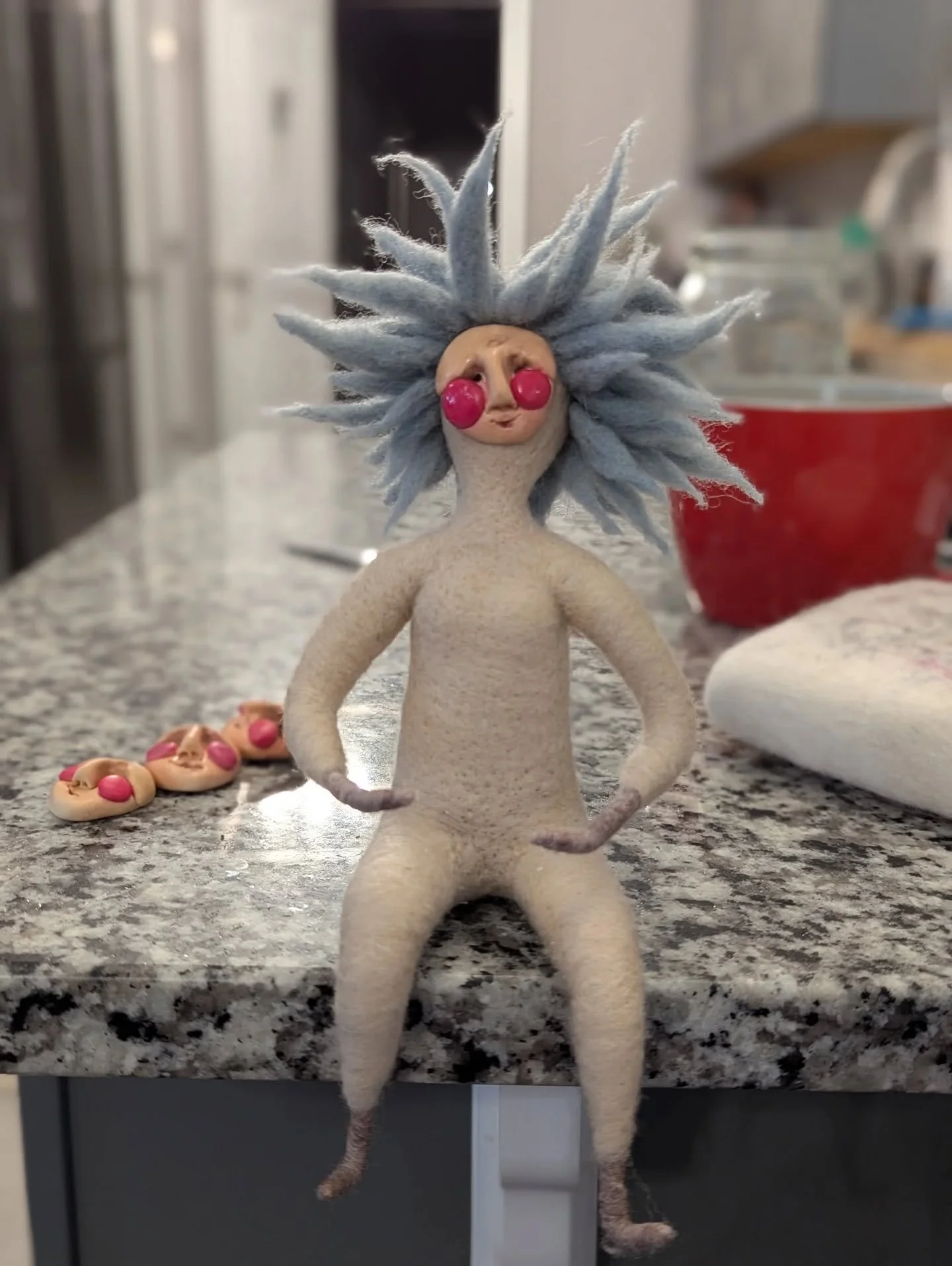 Three faces and two hair colors later.... This little spirit doll is finding her way. 

I know some people plan and plan and then execute the making of their doll according to the plan. Not me. I let things find their way. Every choice is an intuitiv